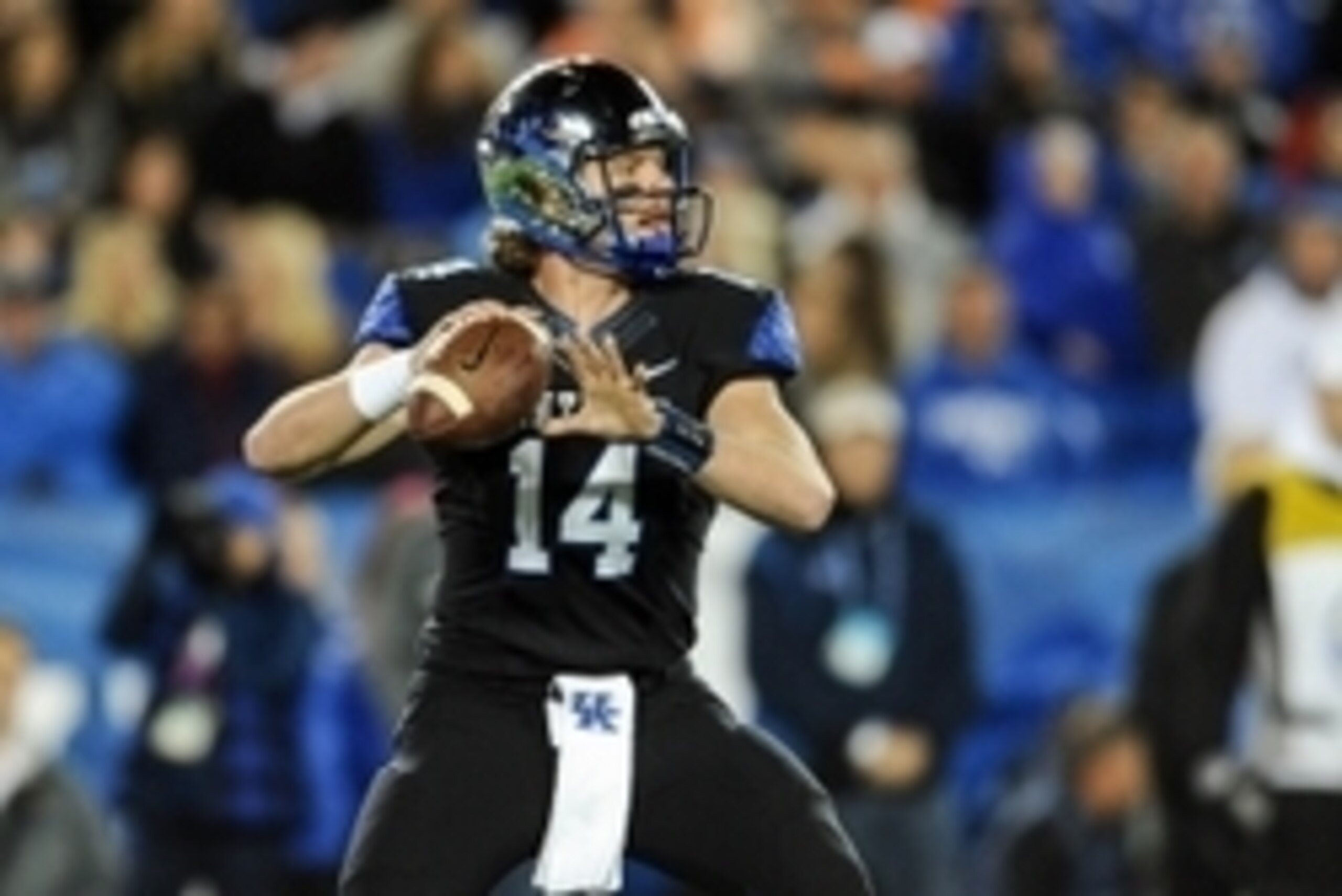 Oct 31, 2015; Lexington, KY, USAKentucky Wildcats quarterback Patrick Towles (14) looks down field against the Tennessee Volunteers at Commonwealth Stadium. Mandatory Credit: Bryan Lynn-USA TODAY Sports