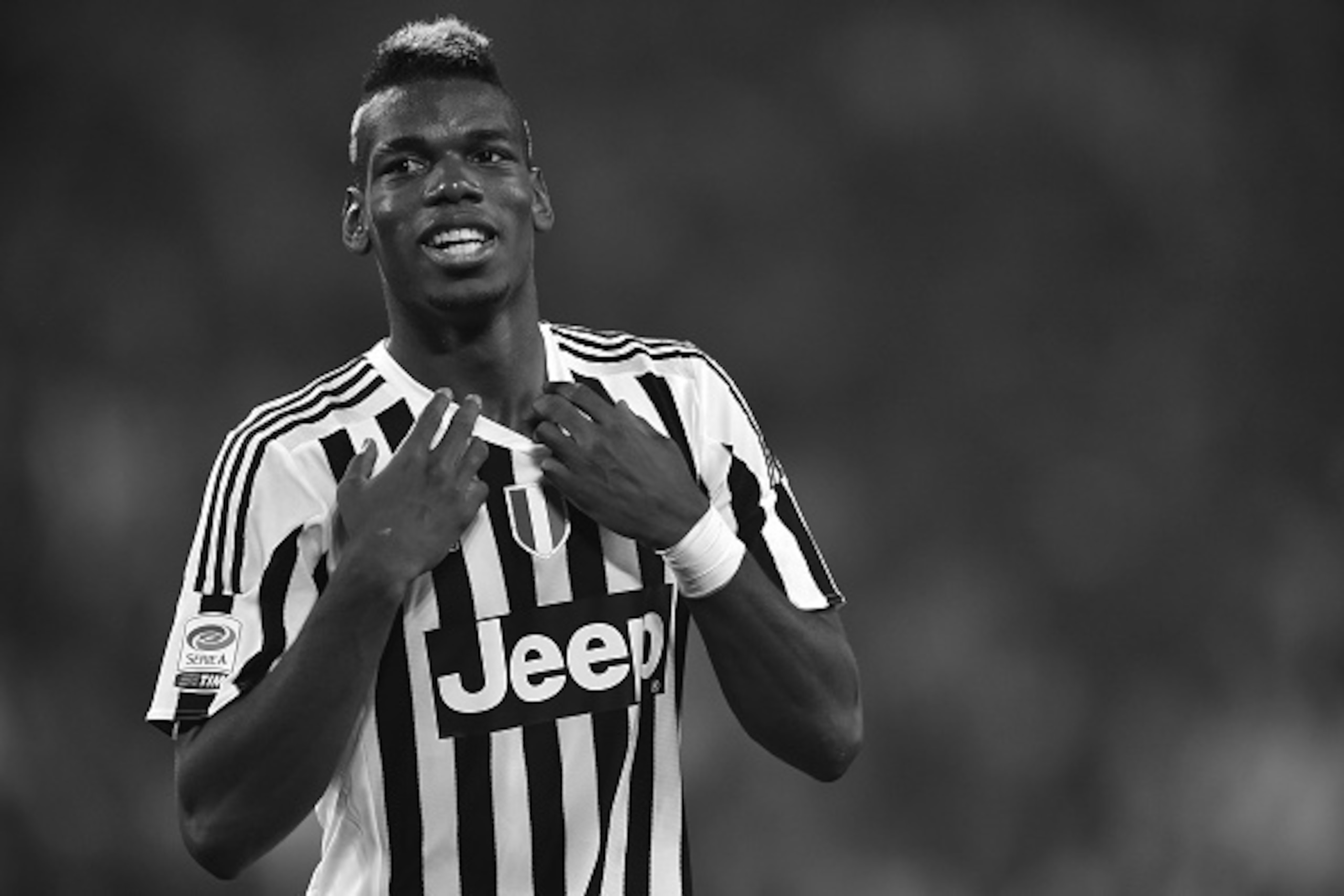 TURIN, ITALY - OCTOBER 31:  (EDITORS NOTE: Images has been converted to black and white.) Paul Pogba of Juventus FC celebrates victory at the end of the Serie A match between Juventus FC and Torino FC at Juventus Arena on October 31, 2015 in Turin, Italy.
