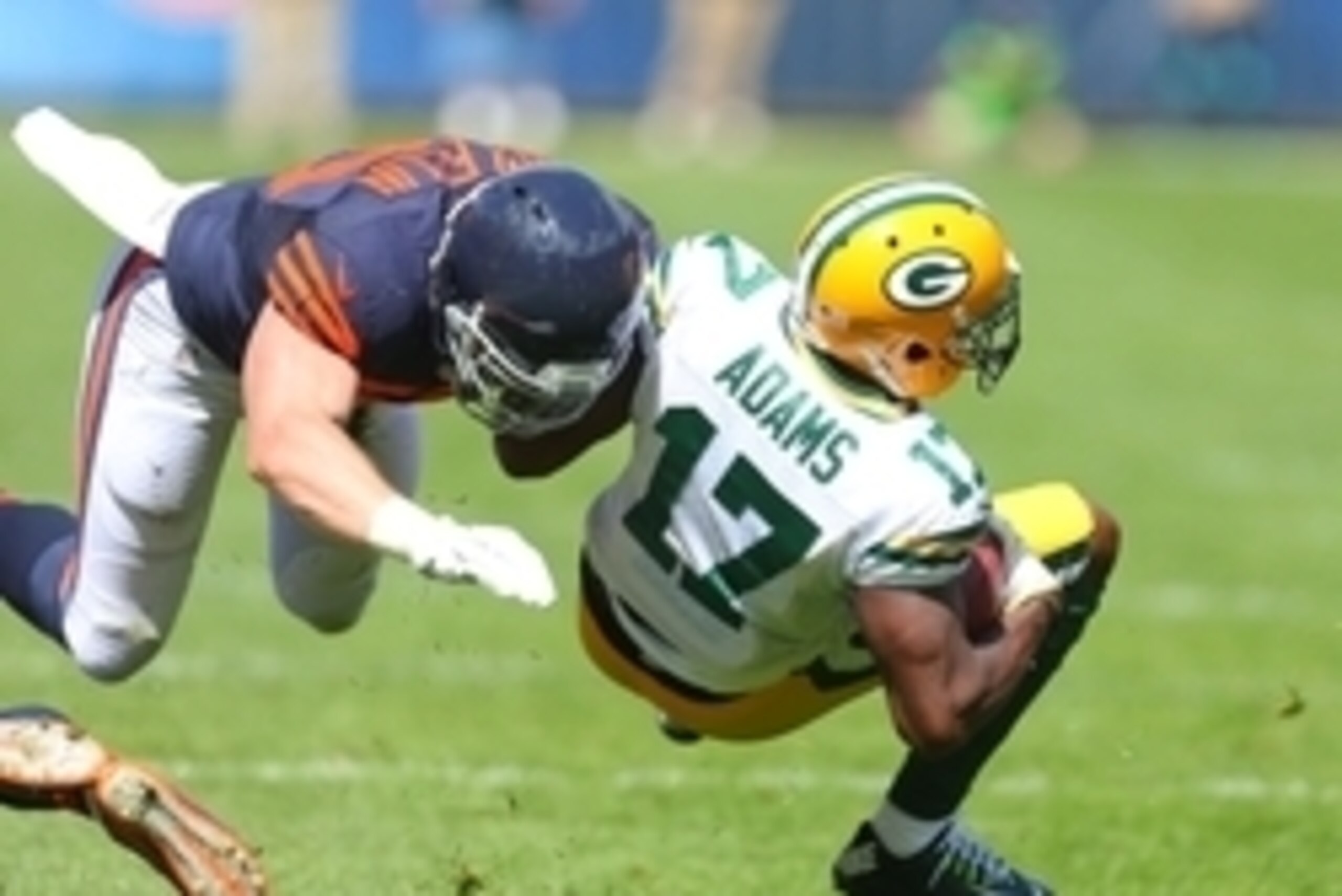Sep 13, 2015; Chicago, IL, USA; Green Bay Packers wide receiver Davante Adams (17) is tackled by Chicago Bears outside linebacker Shea McClellin (50) during the second quarter at Soldier Field. Mandatory Credit: Dennis Wierzbicki-USA TODAY Sports