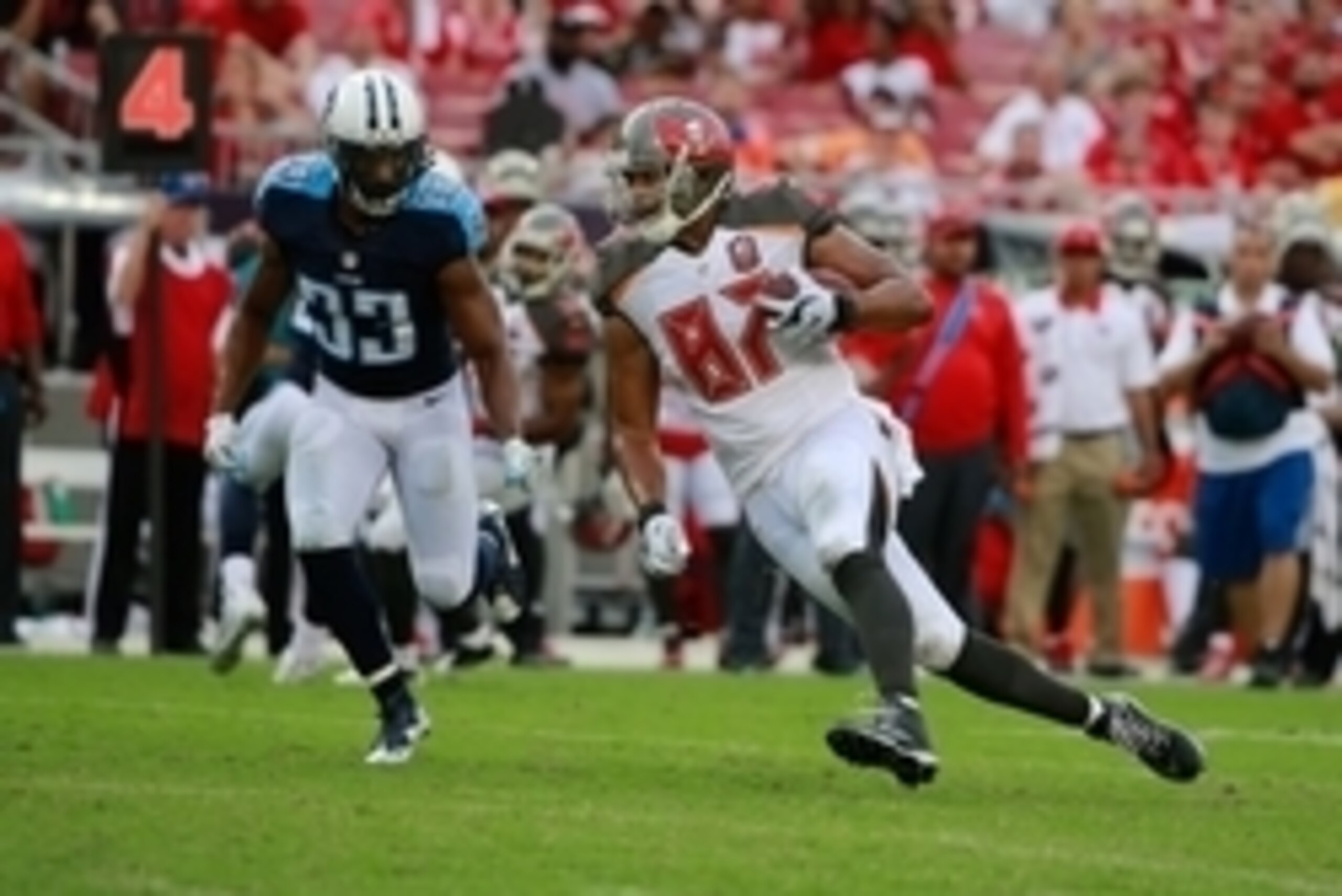 Sep 13, 2015; Tampa, FL, USA; Tampa Bay Buccaneers tight end Austin Seferian-Jenkins (87) runs with the ball as Tennessee Titans free safety Michael Griffin (33) defends during the second half at Raymond James Stadium.  Tennessee Titans defeated the Tampa