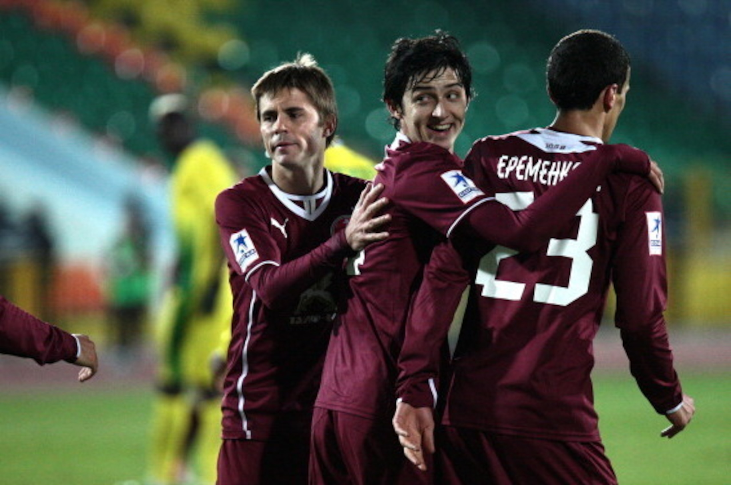 KAZAN, RUSSIA - OCTOBER 06: (L-R) Dmitri Torbinski, Sardar Azmoun and Roman Eremenko of FC Rubin Kazan celebrate after scoring a goal during the Russian Premier League match between FC Rubin Kazan and FC Anzhi Makhachkala at the Tsentraliniy Stadium on Oc