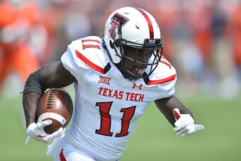 LUBBOCK, TX - SEPTEMBER 12: Jakeem Grant #11 of the Texas Tech Red Raiders runs with the ball during the game against the UTEP Miners on September 12, 2015 at Jones AT&T Stadium in Lubbock, Texas.Texas Tech won the game 69-20. (Photo by John Weast/Getty I