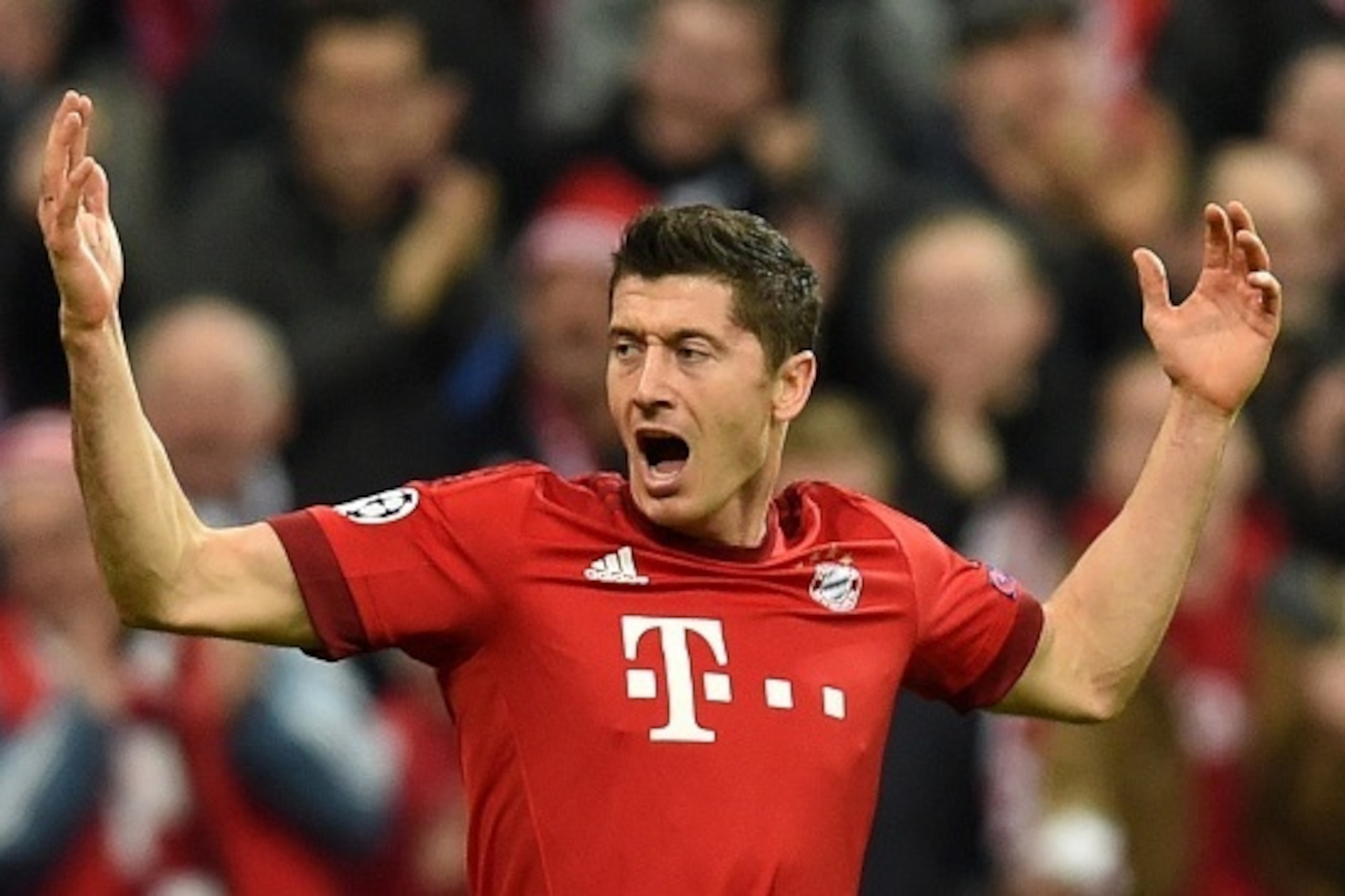 Bayern Munich's Polish striker Robert Lewandowski celebrates scoring the opening goal during the UEFA Champions League Group F second-leg football match between FC Bayern Munich and Arsenal FC in Munich, southern Germany, on November 4, 2015.  AFP PHOTO /