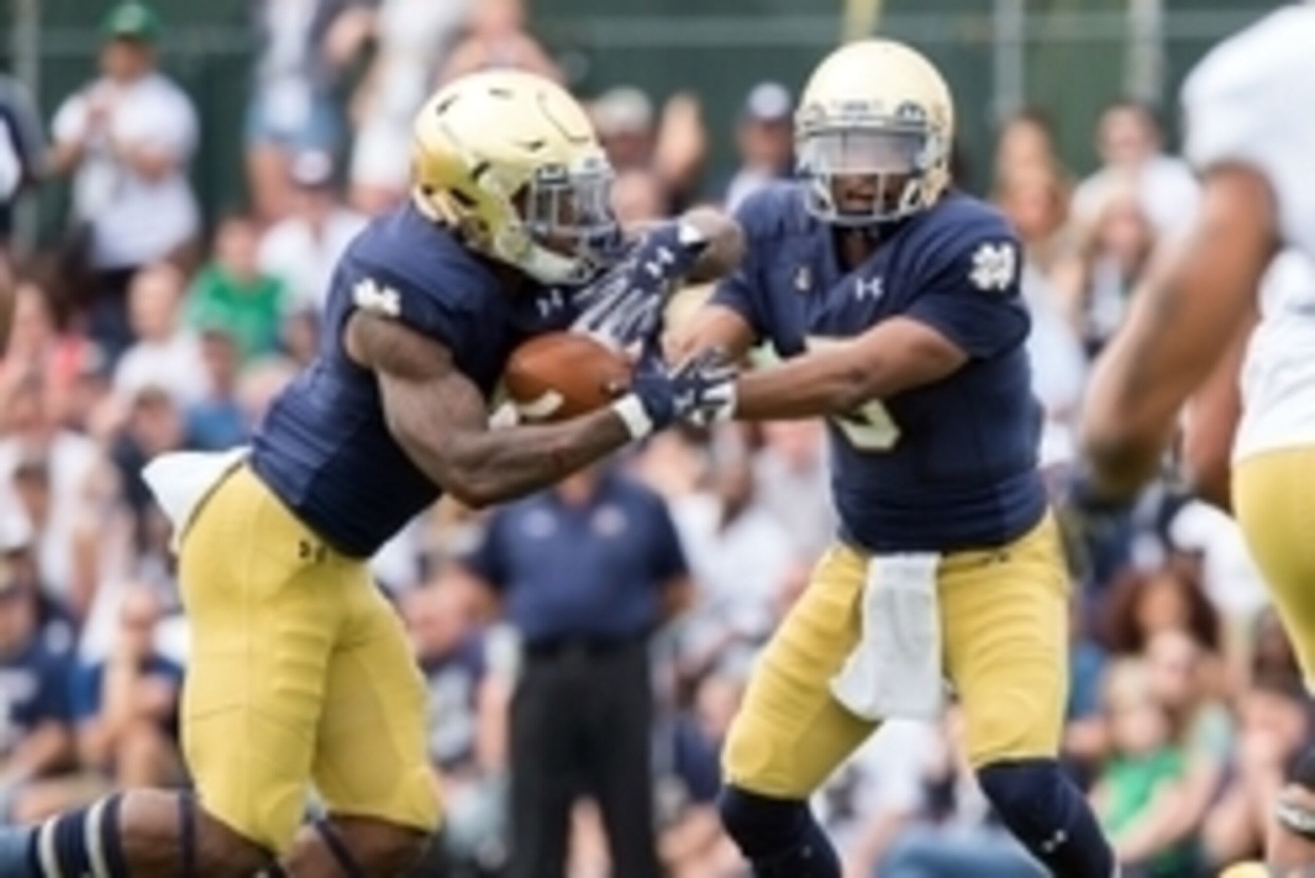 Apr 18, 2015; Notre Dame, IN, USA; Notre Dame Fighting Irish quarterback Everett Golson (5) hands off to running back Greg Bryant (1) in the first quarter of the Blue-Gold Game at the LaBar Practice Complex. Mandatory Credit: Matt Cashore-USA TODAY Sports
