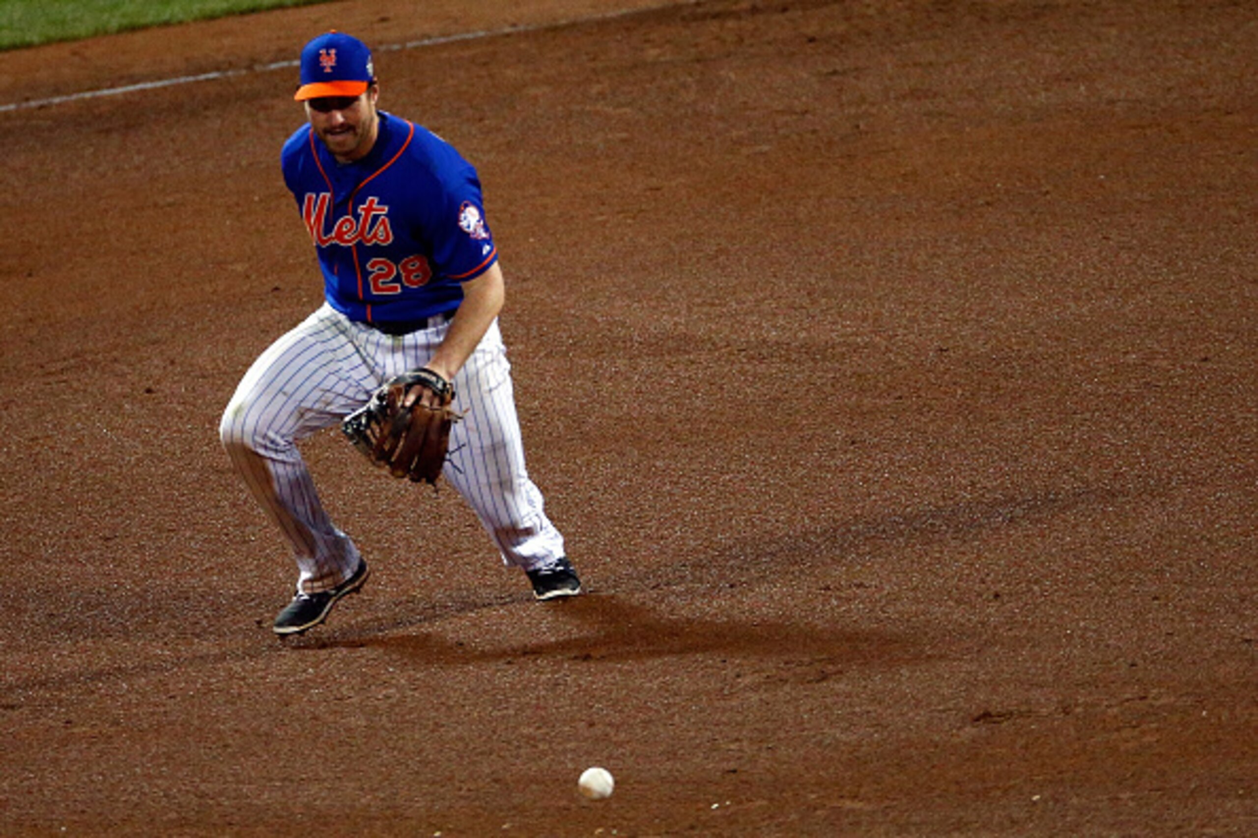 NEW YORK, NY - NOVEMBER 01: Daniel Murphy #28 of the New York Mets makes an error on grounded ball hit by Paulo Orlando #16 of the Kansas City Royals in the twelfth inning during Game Five of the 2015 World Series at Citi Field on November 1, 2015 in the 