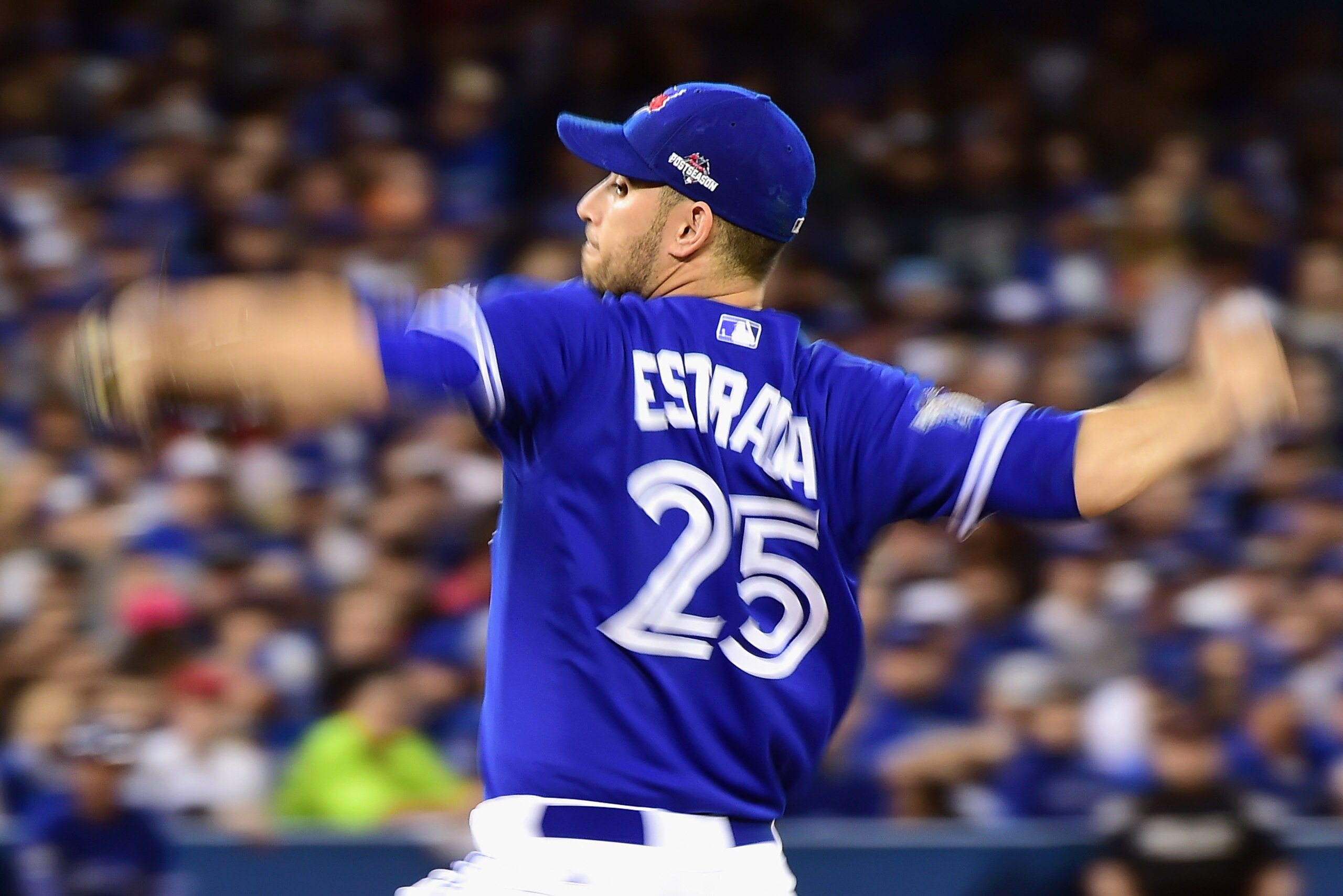 TORONTO, ON - OCTOBER 21:  Marco Estrada #25 of the Toronto Blue Jays throws a pitch in the second inning against the Kansas City Royals during game five of the American League Championship Series at Rogers Centre on October 21, 2015 in Toronto, Canada.