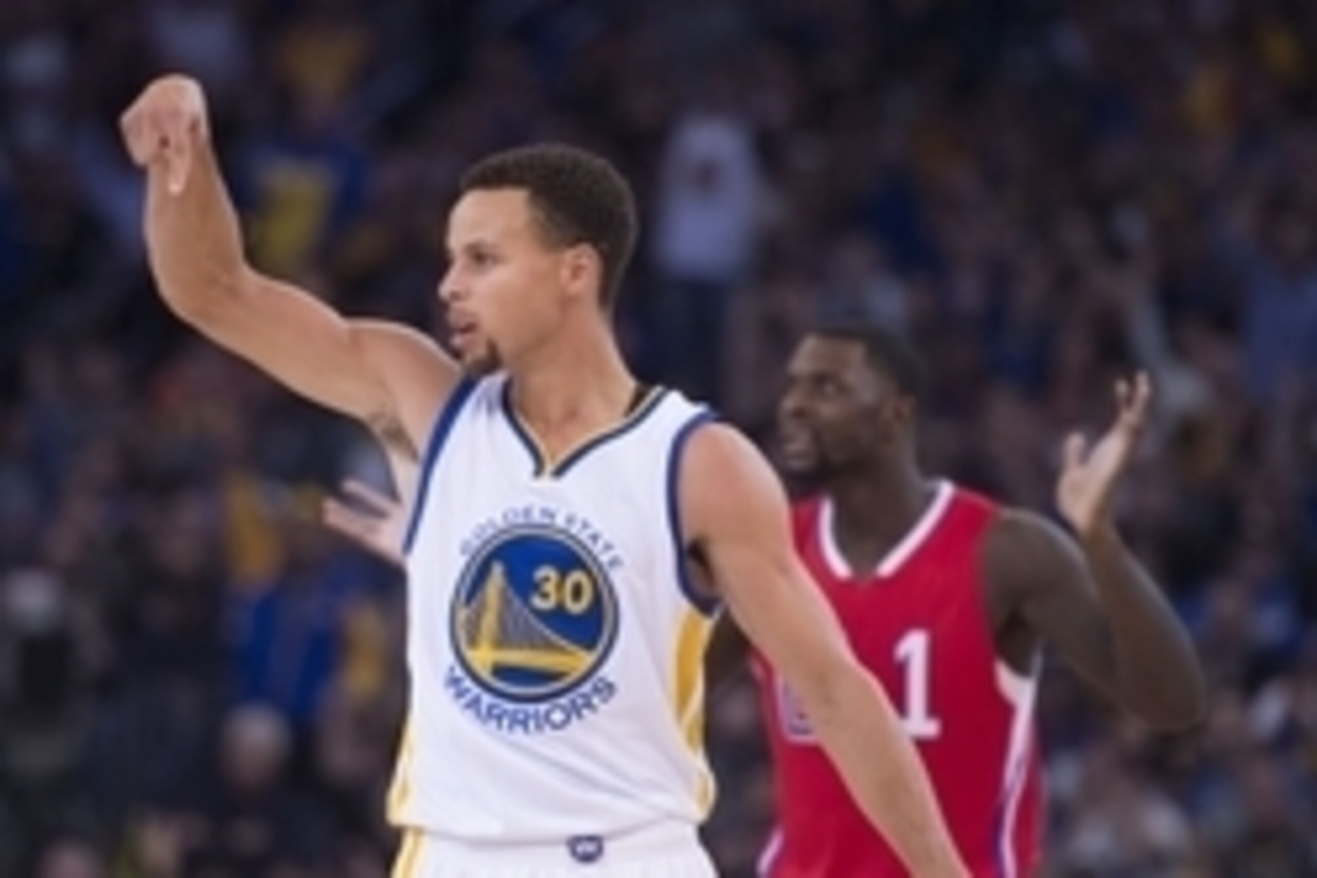 November 4, 2015; Oakland, CA, USA; Golden State Warriors guard Stephen Curry (30) and Los Angeles Clippers forward Lance Stephenson (1) react after a foul call during the second quarter at Oracle Arena. Mandatory Credit: Kyle Terada-USA TODAY Sports
