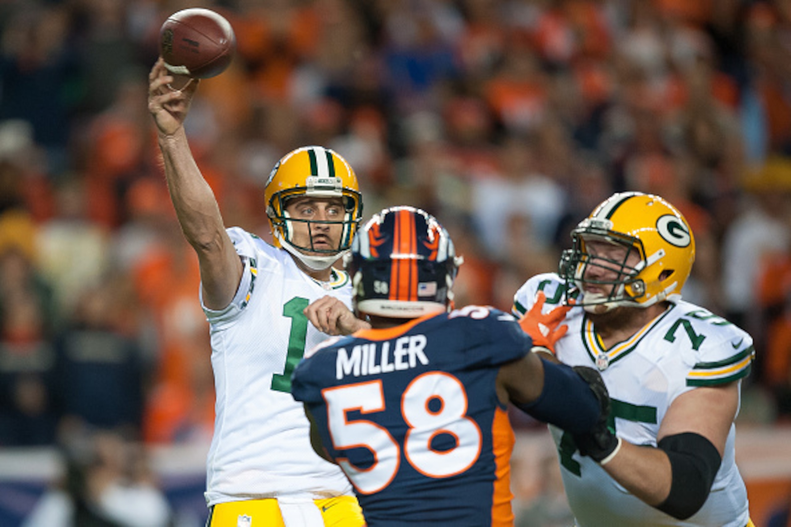 DENVER, CO - NOVEMBER 1: Quarterback Aaron Rodgers #12 of the Green Bay Packers passes against the Denver Broncos at Sports Authority Field at Mile High on November 1, 2015 in Denver, Colorado. (Photo by Dustin Bradford/Getty Images)