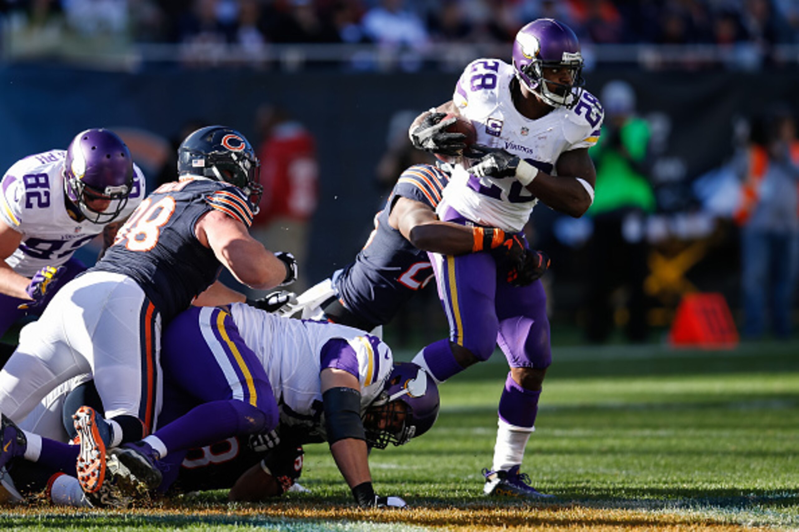 CHICAGO, IL - NOVEMBER 01:   Adrian Peterson #28 of the Minnesota Vikings carries the football against the Chicago Bears in the third quarter at Soldier Field on November 1, 2015 in Chicago, Illinois. The Minnesota Vikings defeat the Chicago Bears 23-20. 