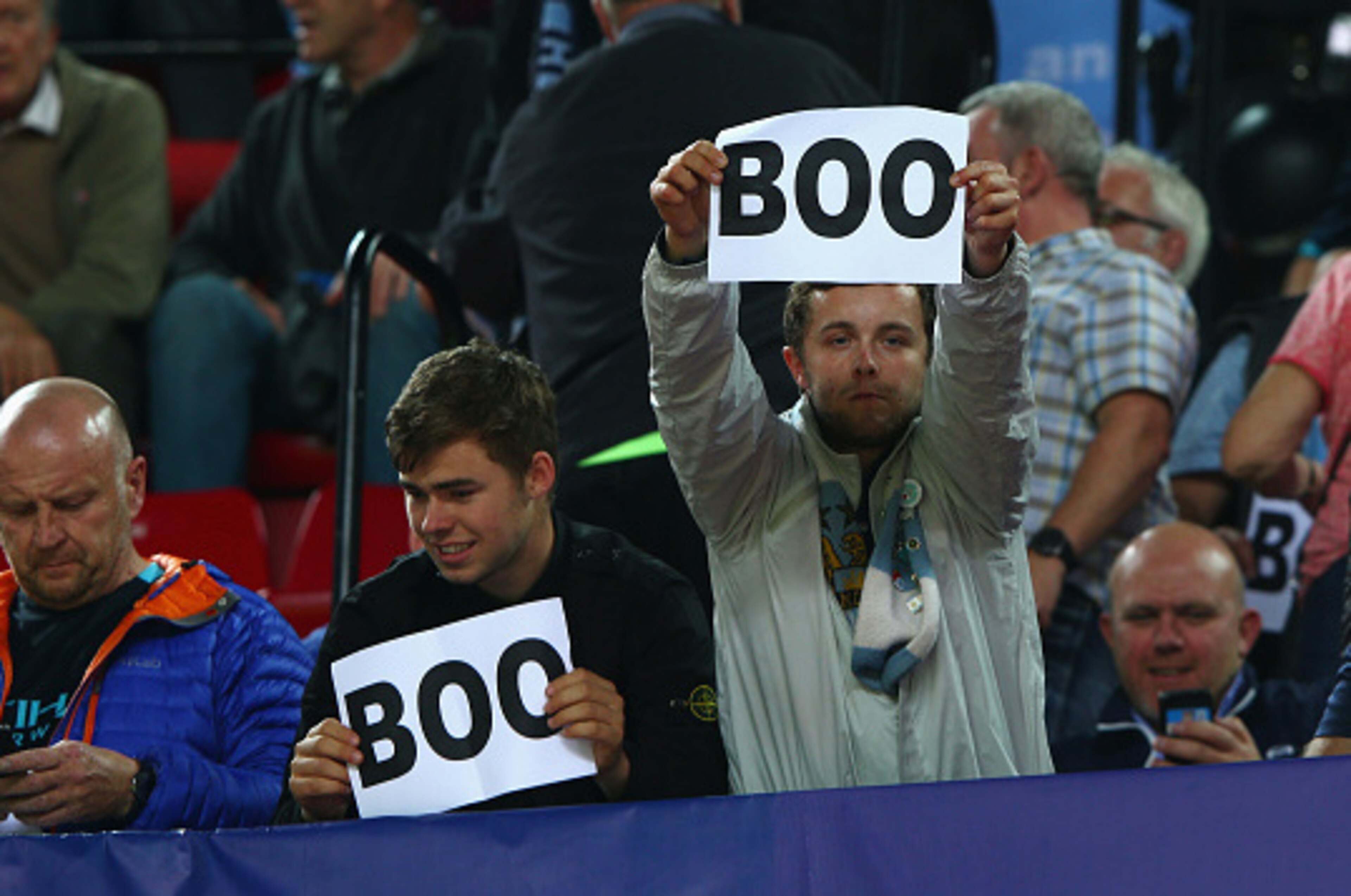 SEVILLE, SPAIN - NOVEMBER 03:  Manchester City fans hold 'Boo' signs prior to the UEFA Champions League Group D match between Sevilla FC and Manchester City FC at Estadio Ramon Sanchez Pizjuan on November 3, 2015 in Seville, Spain.  (Photo by Ian Walton/G