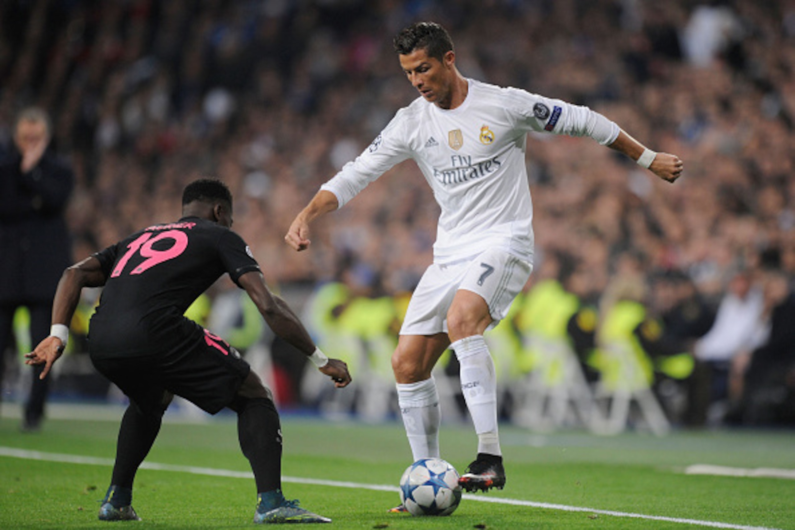 MADRID, SPAIN - NOVEMBER 03:  Cristiano Ronaldo of Real Madrid takes on Serge Aurier of PSG during the UEFA Champions League Group A match between Real Madrid CF and Paris Saint-Germain at Estadio Santiago Bernabeu on November 3, 2015 in Madrid, Spain.  (