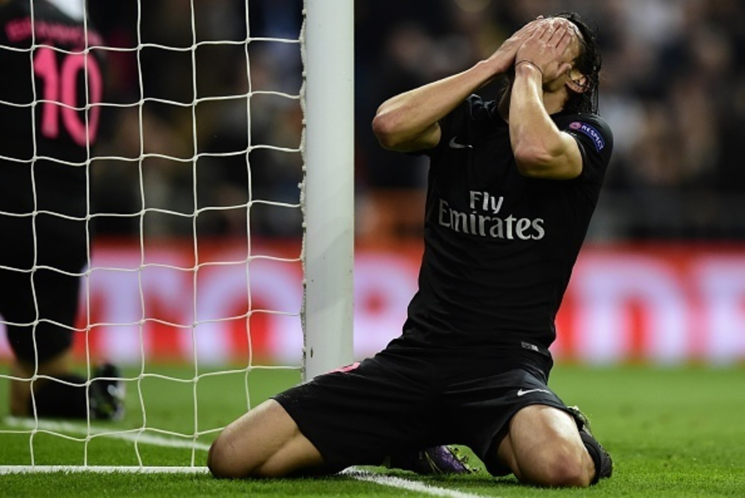 Paris Saint-Germain's Uruguayan forward Edinson Cavani reacts to missing a goal opportunity during the UEFA Champions League football match Real Madrid CF vs Paris Saint-Germain (PSG) at the Santiago Bernabeu stadium in Madrid on November 3, 2015.   AFP P