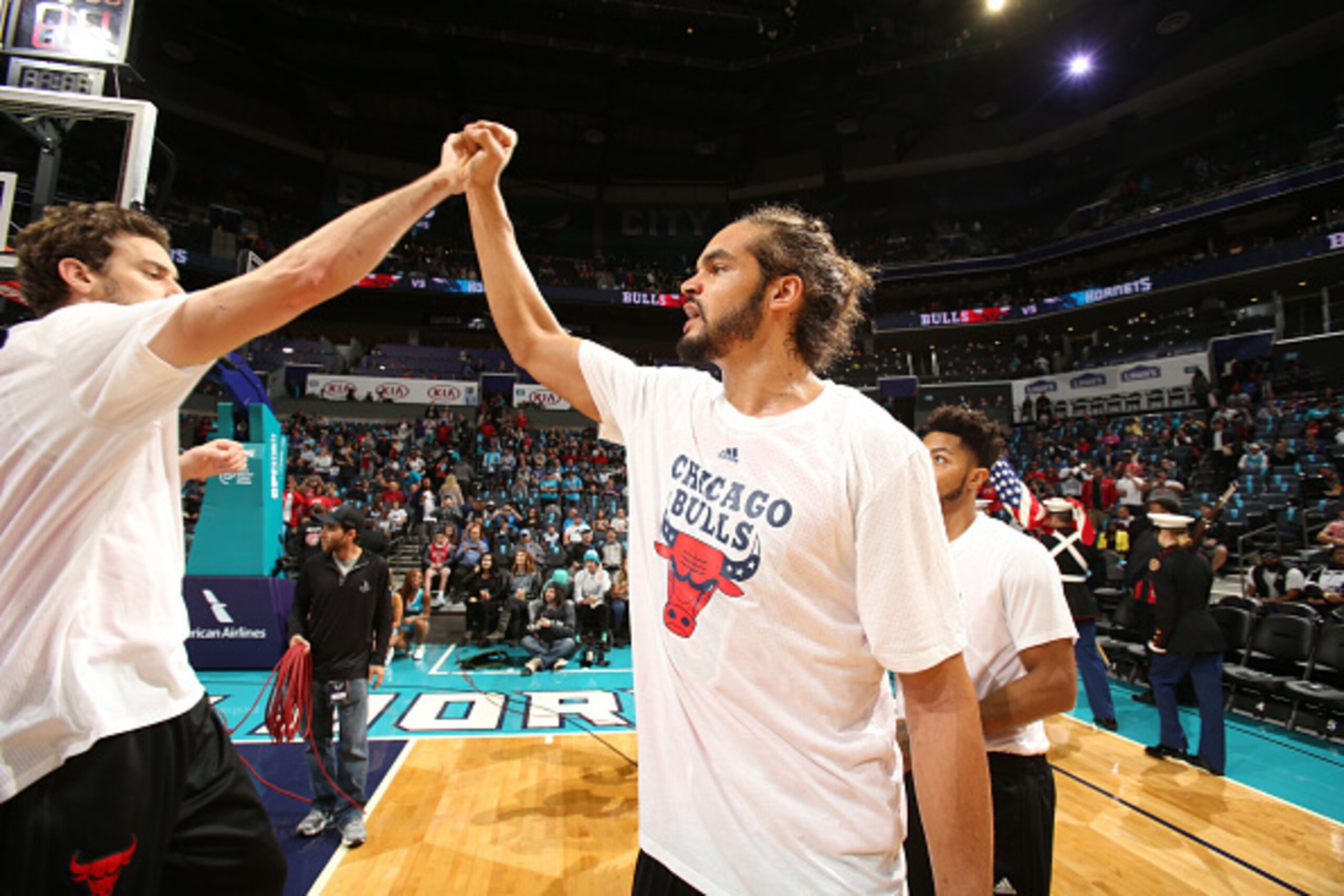 CHARLOTTE, NC - NOVEMBER 03:  Joakim Noah #13 of the Chicago Bulls high fives teammate Pau Gasol #16 of the Chicago Bulls before the game at the Time Warner Cable Arena on November 3, 2015 in Charlotte, North Carolina. NOTE TO USER: User expressly acknowl