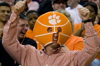 CLEMSON, SC - JANUARY 6: Head football coach Dabo Swinney of the Clemson Tigers shows his support during the Tigers win over the Alabama Crimson Tide at Littlejohn Coliseum January 6, 2009 in Clemson, South Carolina.  (Photo by Rex Brown/Getty Images)