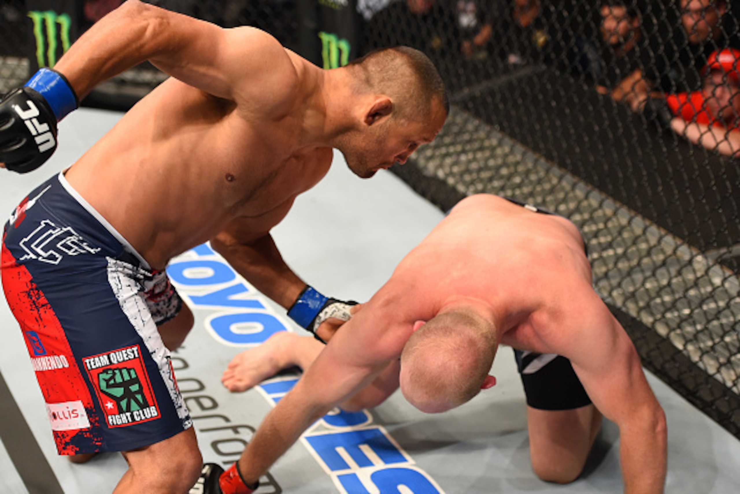 NEW ORLEANS, LA - JUNE 06:   (L-R) Dan Henderson punches Tim Boetsch in their middleweight bout during the UFC event at the Smoothie King Center on June 6, 2015 in New Orleans, Louisiana. (Photo by Josh Hedges/Zuffa LLC/Zuffa LLC via Getty Images)