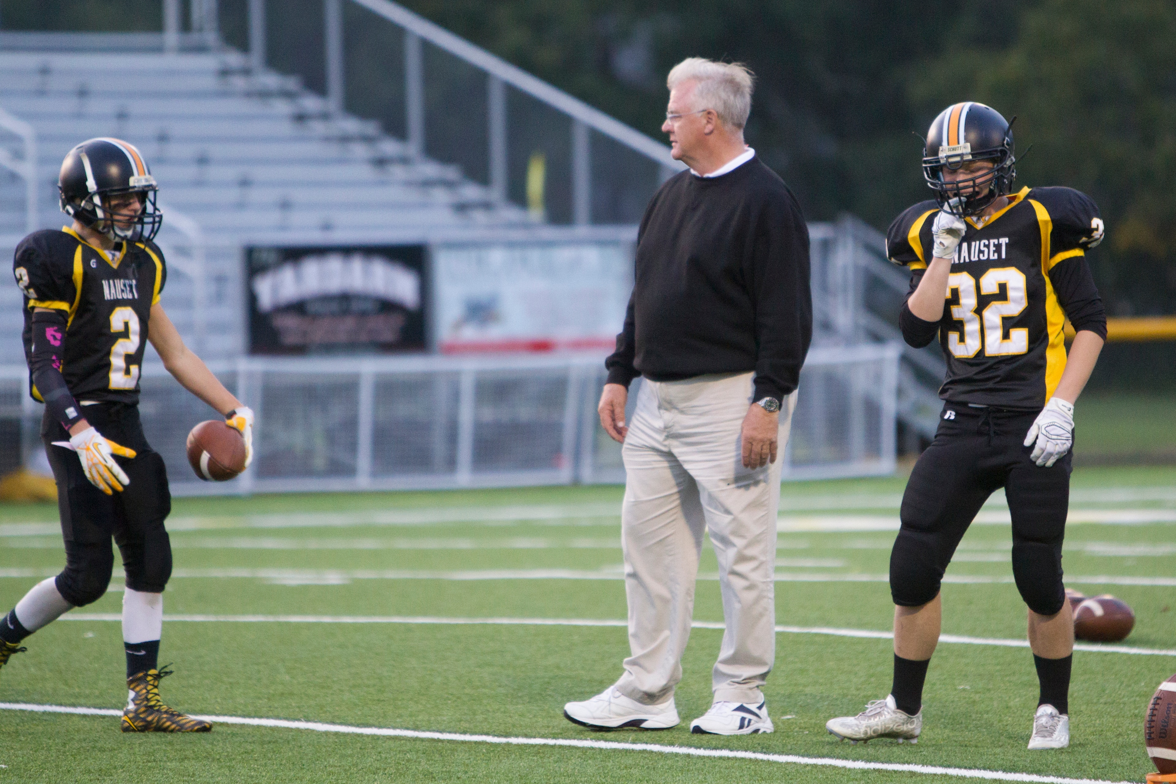 Mike Sherman at practice with Sherman Merrill (2) and James Tooker (32)
