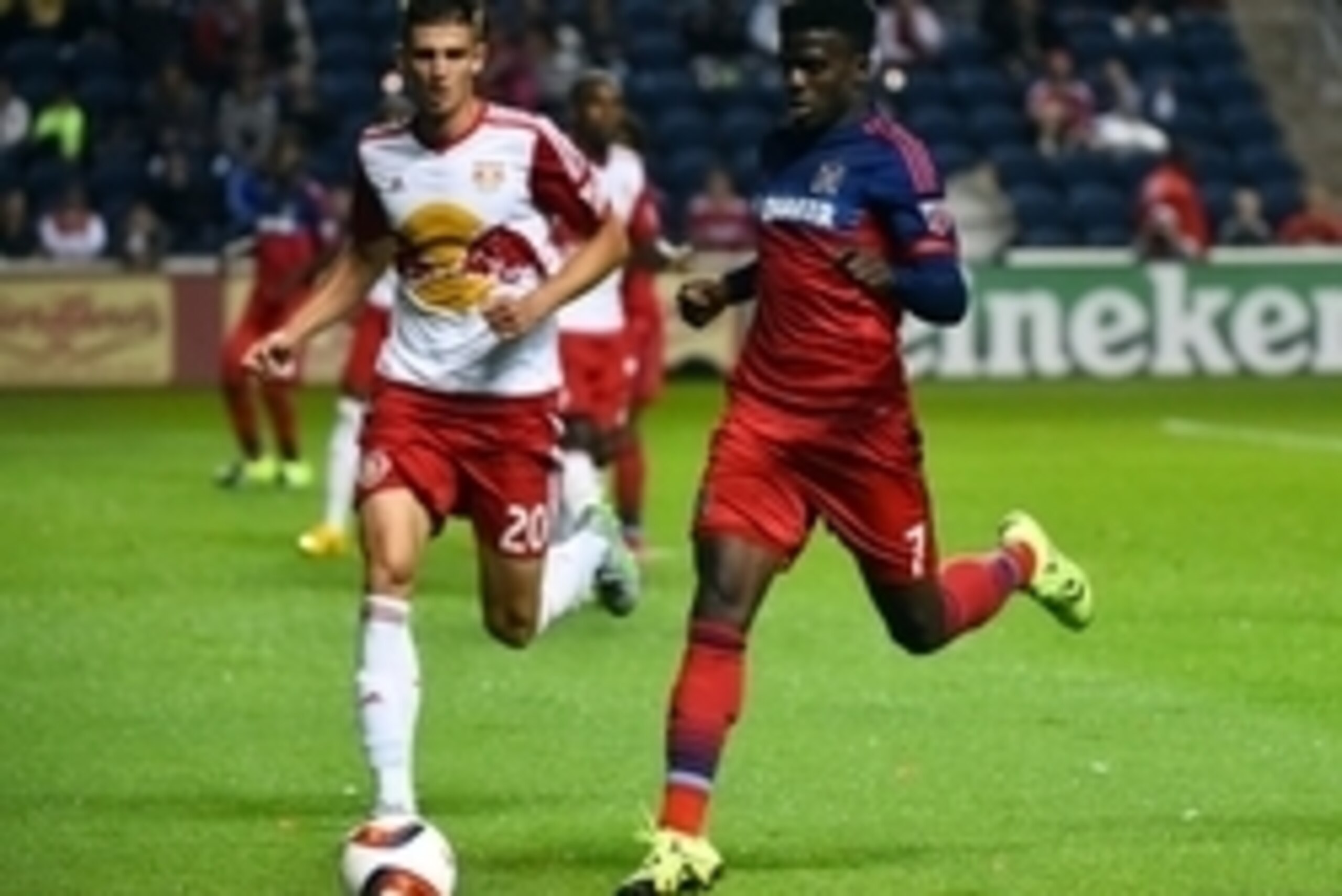 Aug 26, 2015; Chicago, IL, USA; Chicago Fire forward Jason Johnson (7) kicks the ball against New York Red Bulls defender Matt Miazga (20) during the second half at Toyota Park. Mandatory Credit: Mike DiNovo-USA TODAY Sports