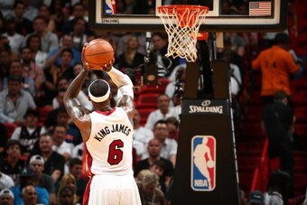 MIAMI, FL - APRIL 8: LeBron James #6 of the Miami Heat shoots the ball against the Brooklyn Nets during game on April 8, 2014 at American Airlines Arena in Miami, Florida.  NOTE TO USER: User expressly acknowledges and agrees that, by downloading and or u