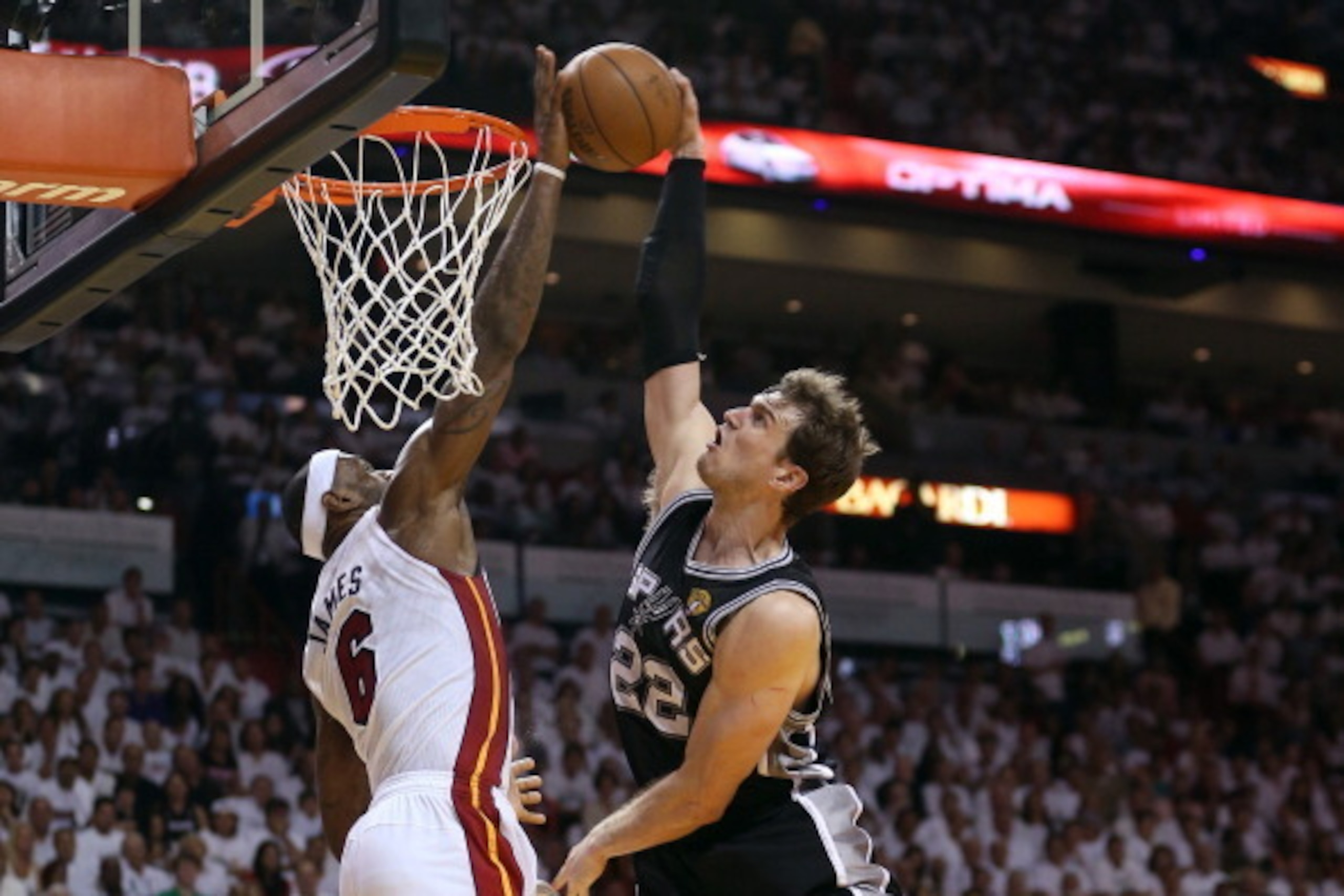 MIAMI, FL - JUNE 09:  LeBron James #6 of the Miami Heat blocks the shot of Tiago Splitter #22 of the San Antonio Spurs in the fourth quarter during Game Two of the 2013 NBA Finals at AmericanAirlines Arena on June 9, 2013 in Miami, Florida. NOTE TO USER: 