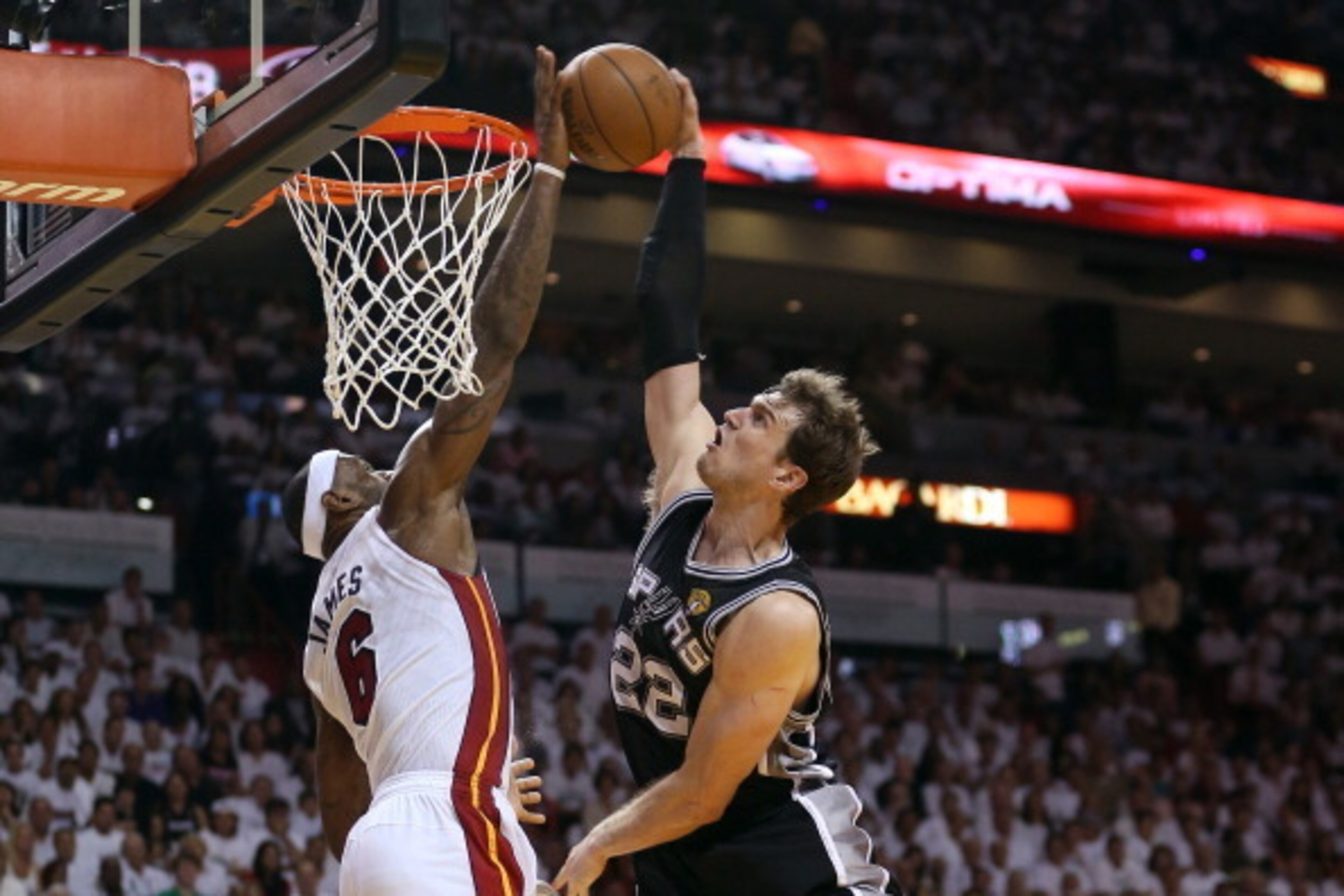 MIAMI, FL - JUNE 09:  LeBron James #6 of the Miami Heat blocks the shot of Tiago Splitter #22 of the San Antonio Spurs in the fourth quarter during Game Two of the 2013 NBA Finals at AmericanAirlines Arena on June 9, 2013 in Miami, Florida. NOTE TO USER: 