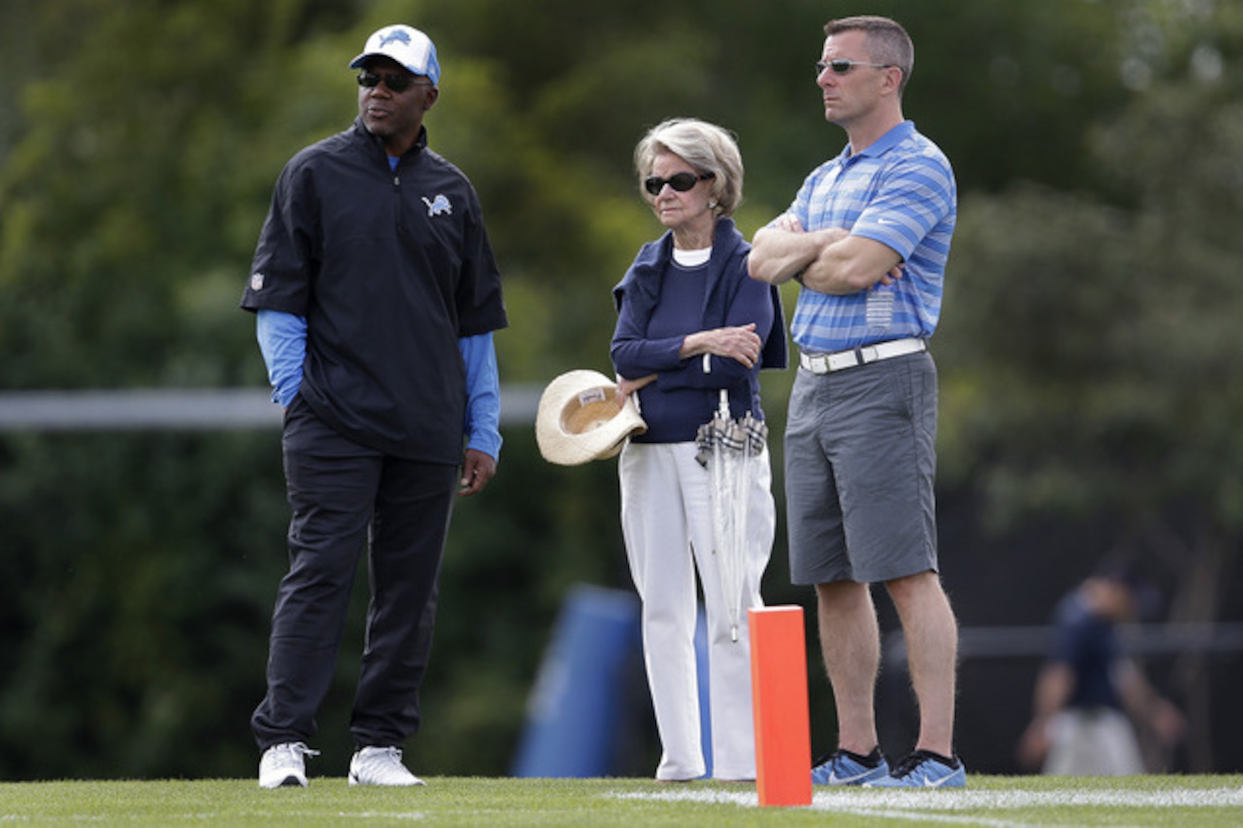 Martin Mayhew, Martha Ford and Tom Lewand, in happier times.