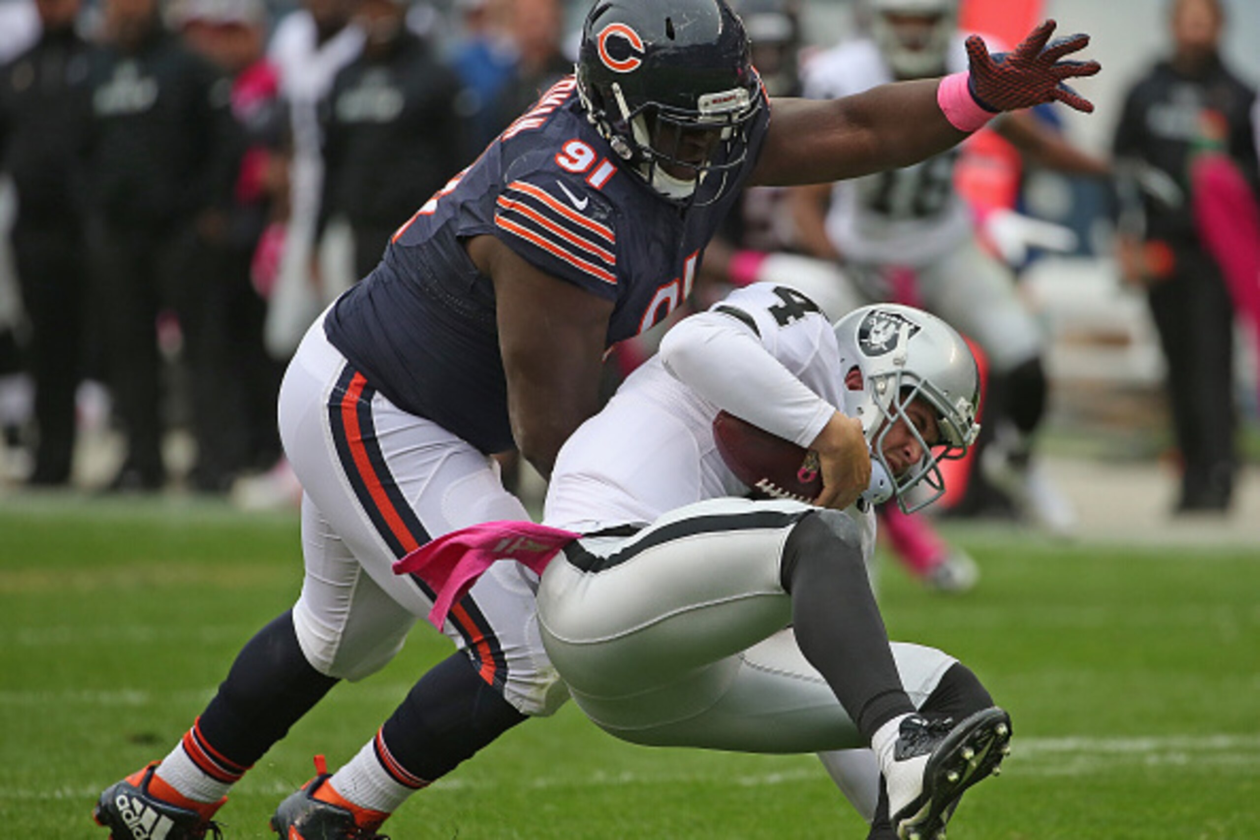 CHICAGO, IL - OCTOBER 04:  Eddie Goldman #91 of the Chicago Bears sacks Derek Carr #4 of the Oakland Raiders at Soldier Field on October 4, 2015 in Chicago, Illinois. The Bears defeated the Raiders 22-20.  (Photo by Jonathan Daniel/Getty Images)