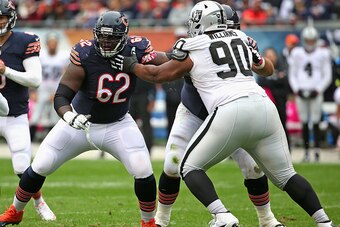 CHICAGO, IL - OCTOBER 04:  Vladimir Ducasse #62 of the Chicago Bears looks to block Dan Williams #90 of the Oakland Raiders at Soldier Field on October 4, 2015 in Chicago, Illinois. The Bears defeated the Raiders 22-20.  (Photo by Jonathan Daniel/Getty Im