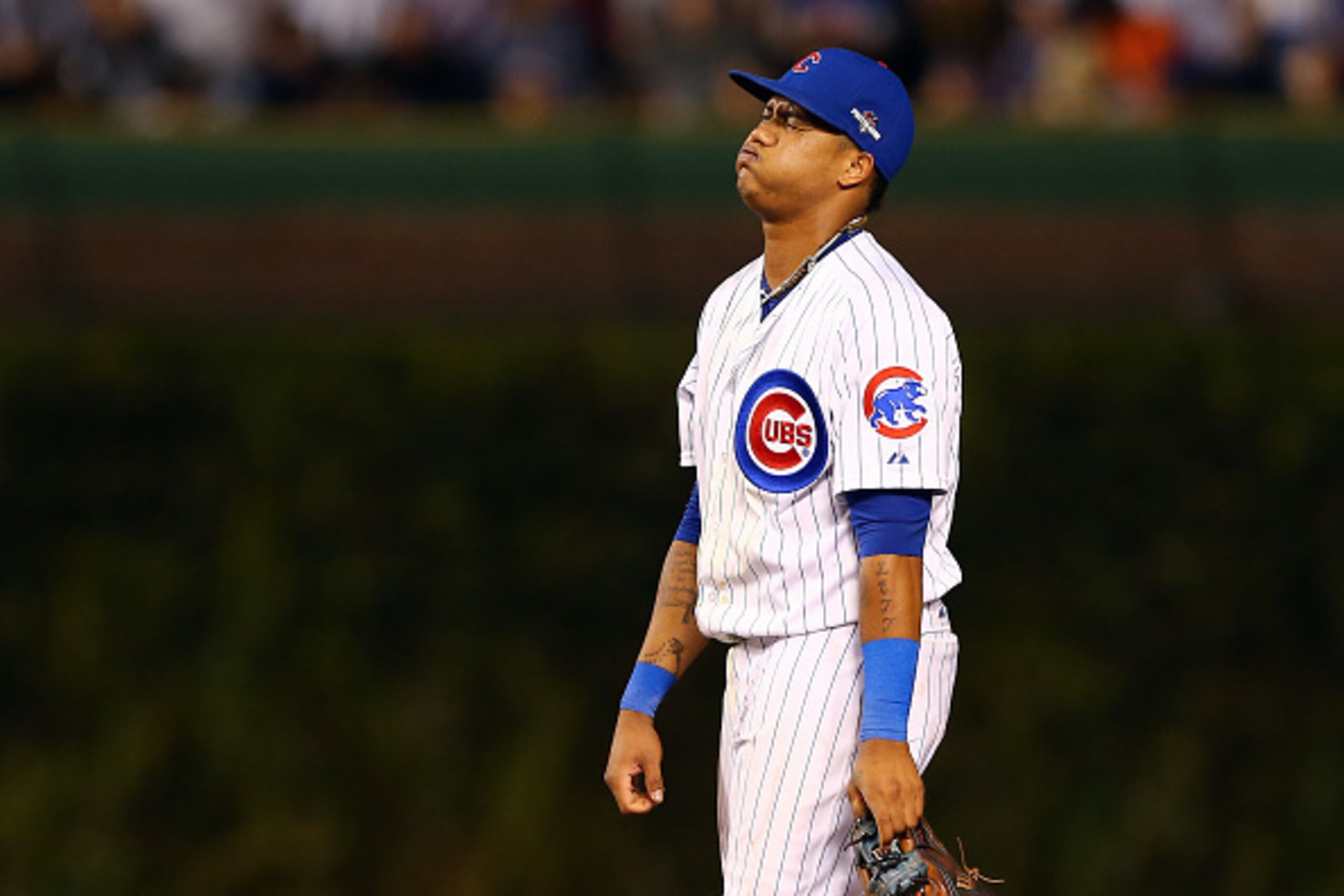 CHICAGO, IL - OCTOBER 21:  Starlin Castro #13 of the Chicago Cubs reacts against the New York Mets during game four of the 2015 MLB National League Championship Series at Wrigley Field on October 21, 2015 in Chicago, Illinois.  (Photo by Elsa/Getty Images