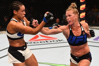 SAN DIEGO, CA - JULY 15:   (R-L) Holly Holm punches Marion Reneau in their women's bantamweight bout during the UFC event at the Valley View Casino Center on July 15, 2015 in San Diego, California. (Photo by Jeff Bottari/Zuffa LLC/Zuffa LLC via Getty Imag