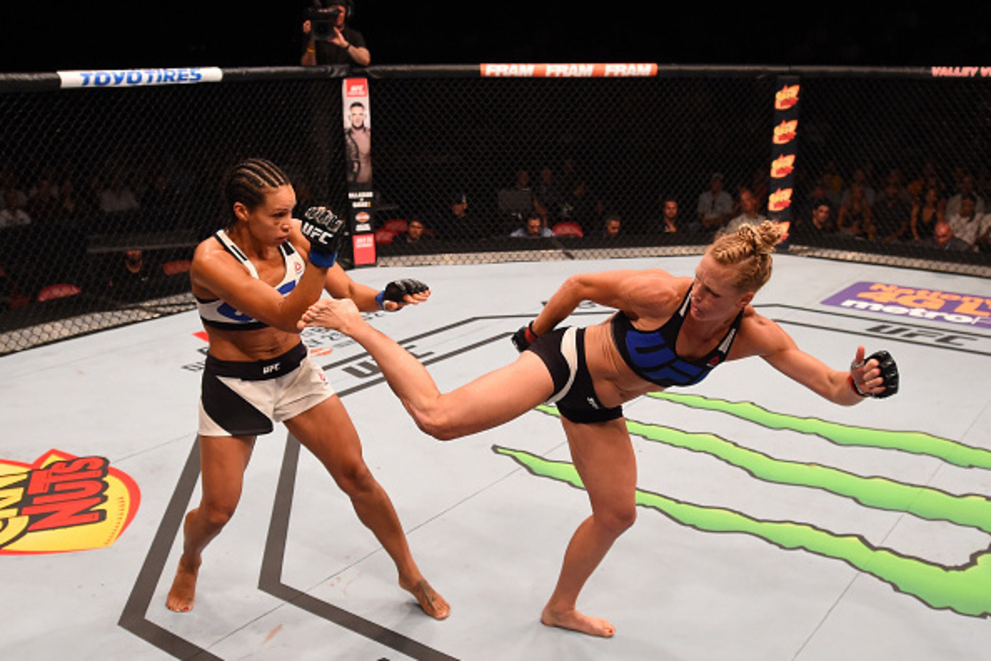 SAN DIEGO, CA - JULY 15:   (R-L) Holly Holm kicks Marion Reneau in their women's bantamweight bout during the UFC event at the Valley View Casino Center on July 15, 2015 in San Diego, California. (Photo by Jeff Bottari/Zuffa LLC/Zuffa LLC via Getty Images