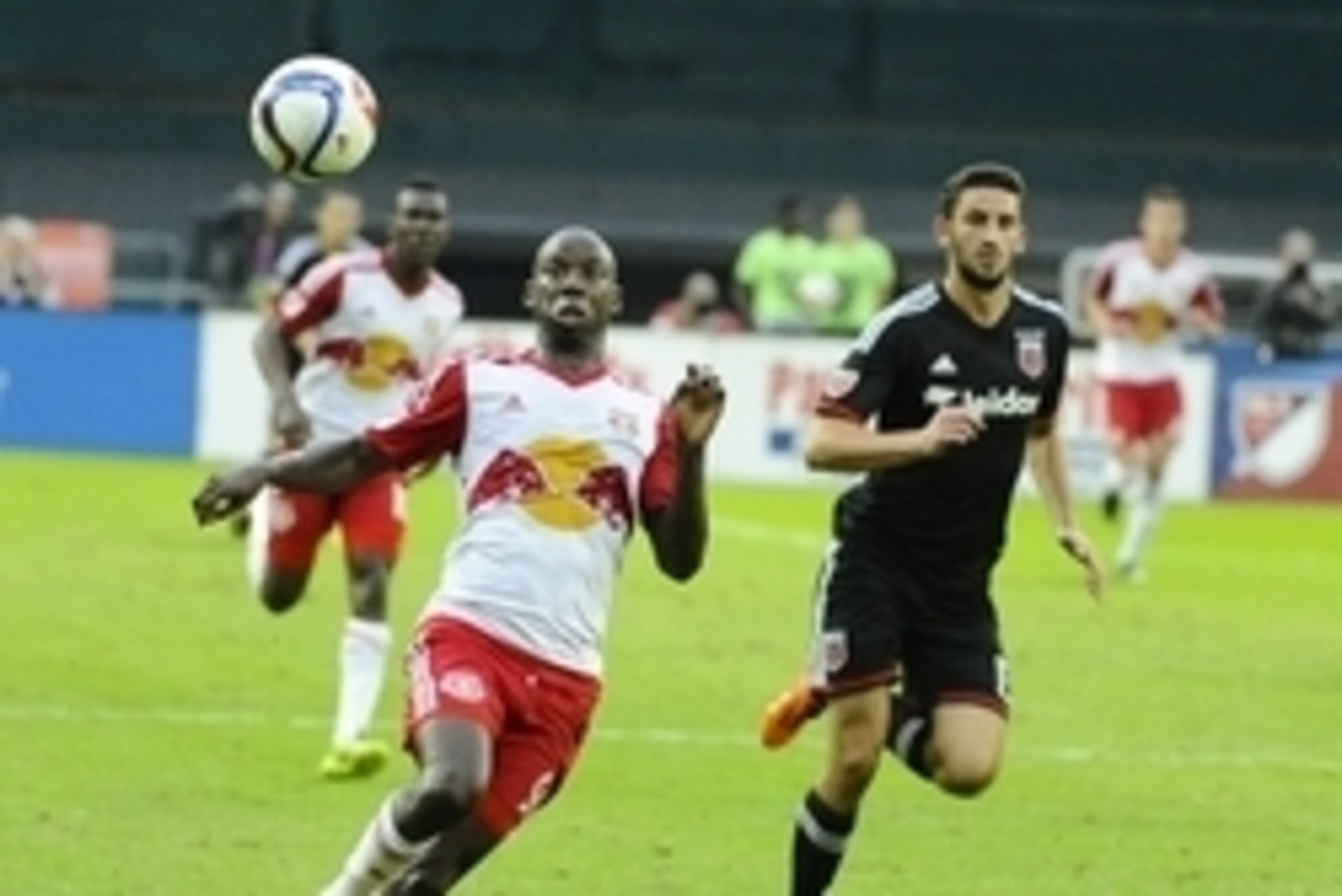 Nov 1, 2015; Washington, DC, USA; New York Red Bulls forward Bradley Wright-Phillips (99) dribbles the ball in front of D.C. United defender Steve Birnbaum (15) during the second half at Robert F. Kennedy Memorial. The Red Bulls won the first leg of the E