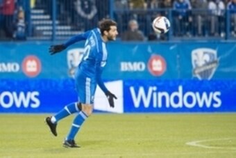 Nov 1, 2015; Montreal, Quebec, CAN;  Montreal Impact midfielder Ignacio Piatti (10) heads the ball in the first half against the Columbus Crew at Stade Saputo. Mandatory Credit: Marc DesRosiers-USA TODAY Sports
