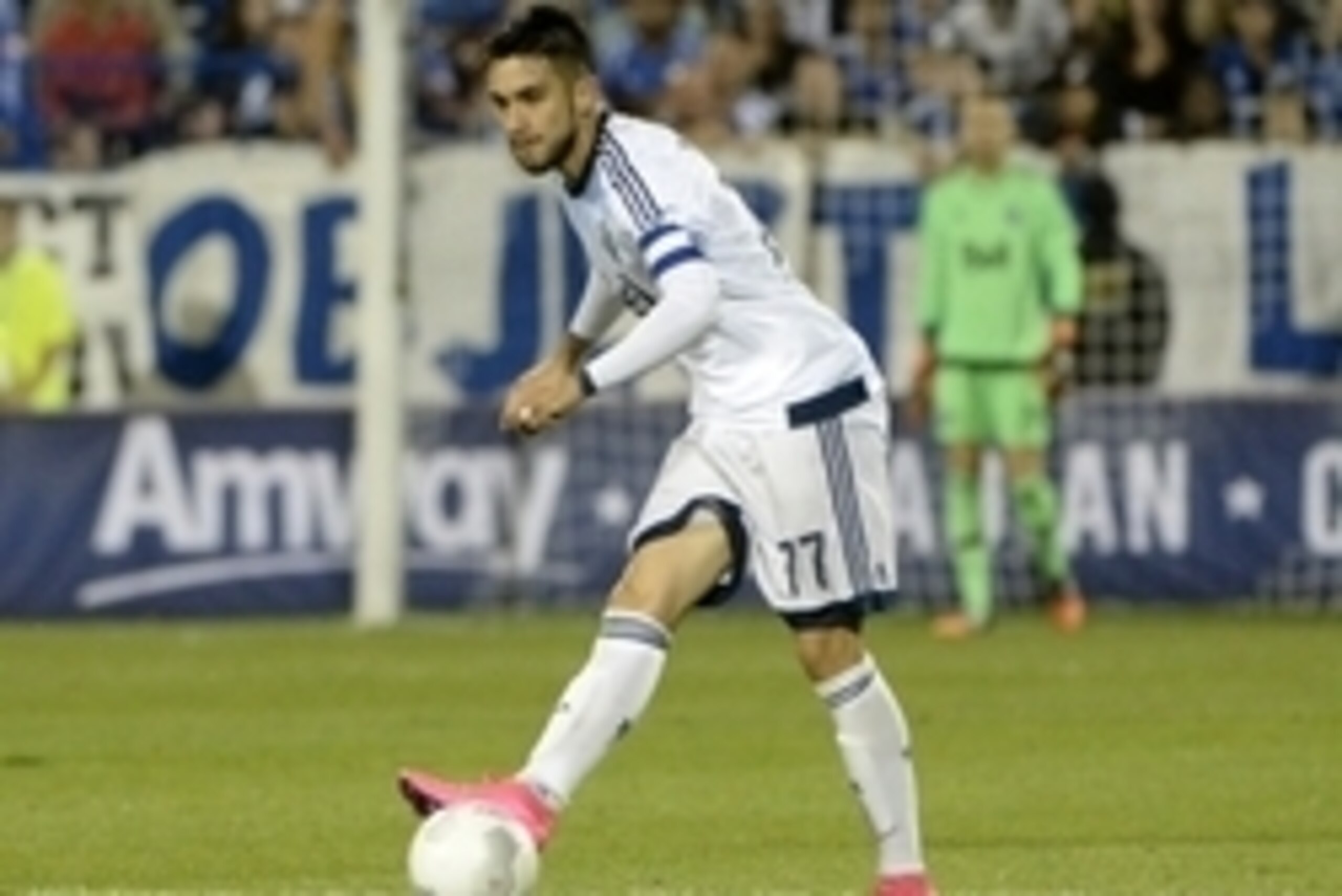 Aug 12, 2015; Montreal, Quebec, Canada; Vancouver Whitecaps midfielder Pedro Morales (77) plays the ball against the Montreal Impact during the second half at Stade Saputo. Mandatory Credit: Eric Bolte-USA TODAY Sports
