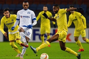 CORRECTION - NAME OF VILLARREAL'S PLAYER
Dinamo Minsk's defender Umaru Bangura (2ndL) vies for the ball with Villarreal's Congoleseforward Cedric Bakambu (2ndR) during the UEFA Europa League group E football match between FC Dinamo Minsk and Villarreal CF