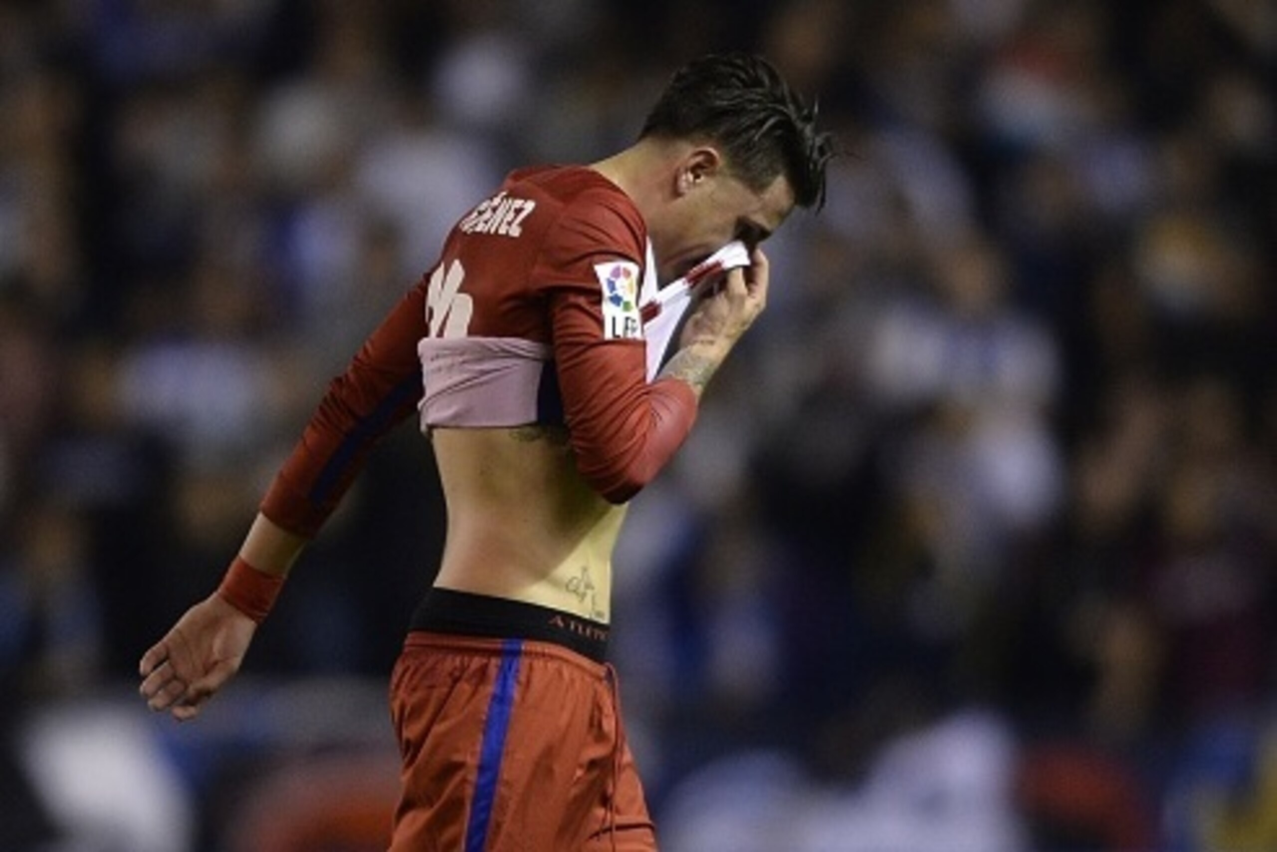 Atletico Madrid's Uruguayan defender Jose Maria Gimenez walks at the end of the Spanish league football match RC Deportivo La Coruna vs Club Atletico de Madrid at the Municipal de Riazor stadium in La Coruna on October 30, 2015.  The match finished with a