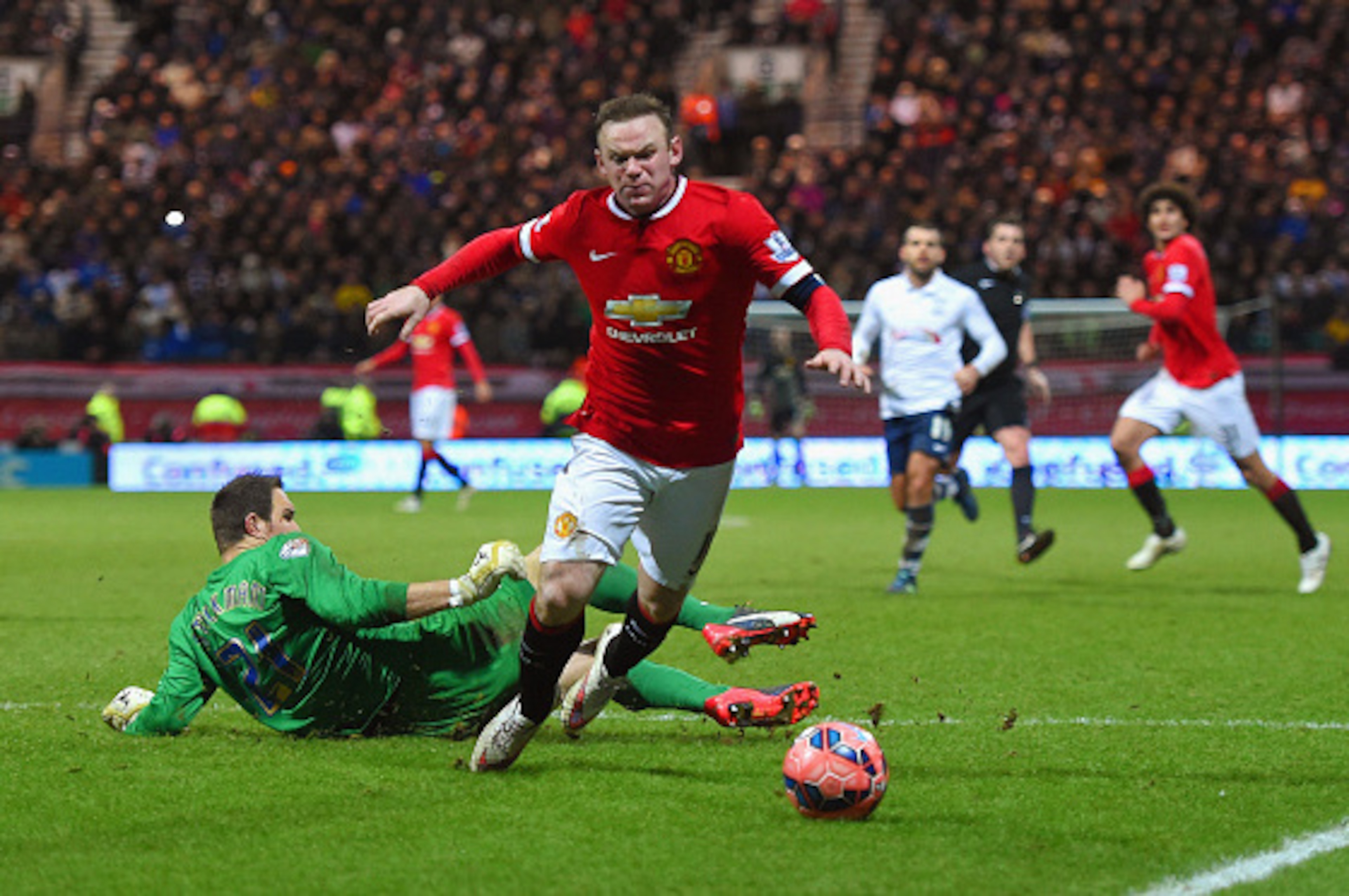 PRESTON, ENGLAND - FEBRUARY 16: Wayne Rooney of Manchester United draws a foul from Thorsten Stuckmann of Preston North End to win a penalty during the FA Cup Fifth round match between Preston North End and Manchester United at Deepdale on February 16, 2 PRESTON, ENGLAND - FEBRUARY 16: Wayne Rooney of Manchester United draws a foul from Thorsten Stuckmann of Preston North End to win a penalty during the FA Cup Fifth round match between Preston North End and Manchester United at Deepdale on February 16, 2