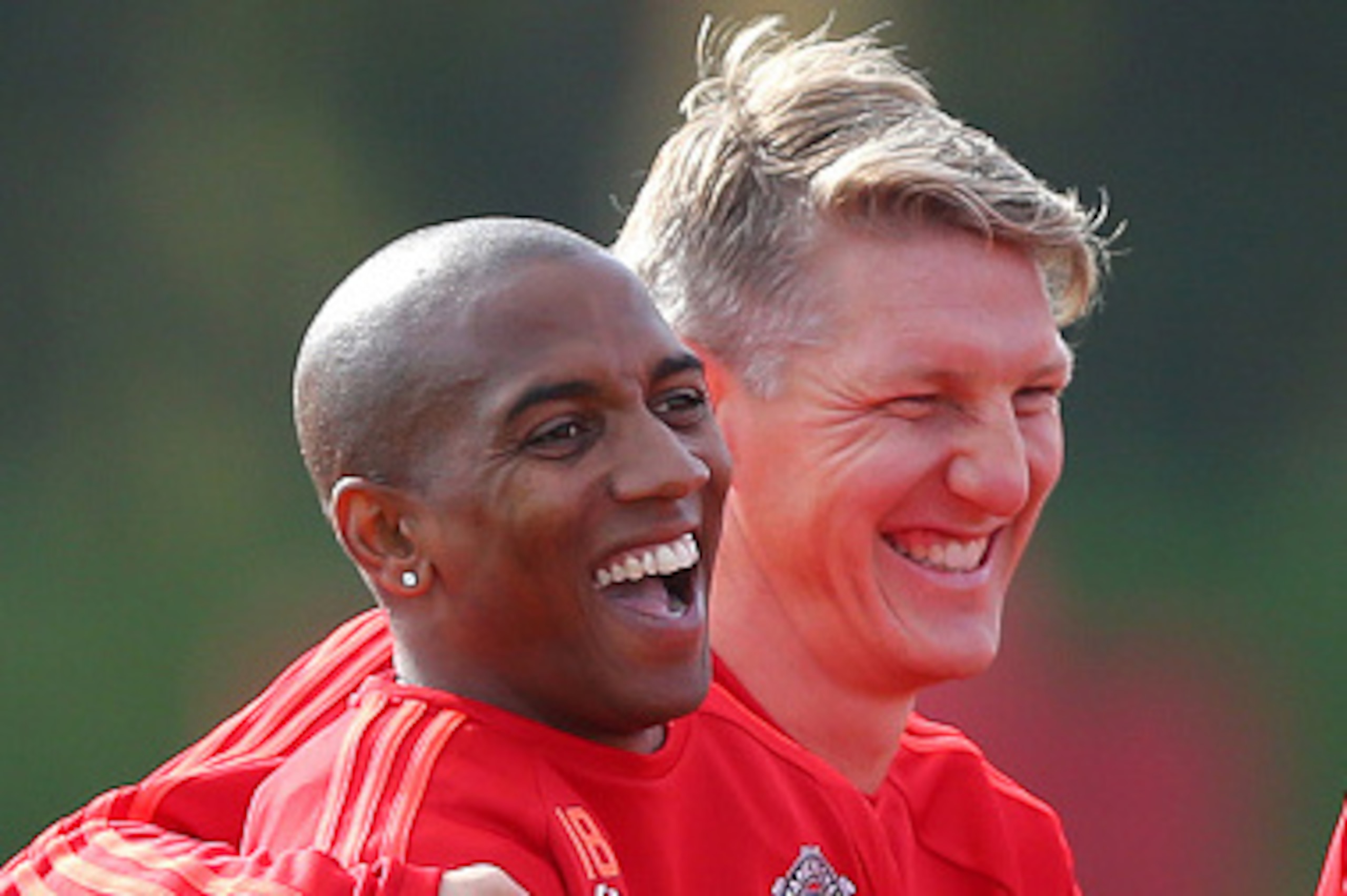 MANCHESTER, ENGLAND - SEPTEMBER 29: Ashley Young of Manchester United laughs alongside Bastian Schweinsteiger, right, during a Manchester United training session at the Aon Training Complex on September 29, 2015 in Manchester, England. (Photo by Dave Thom