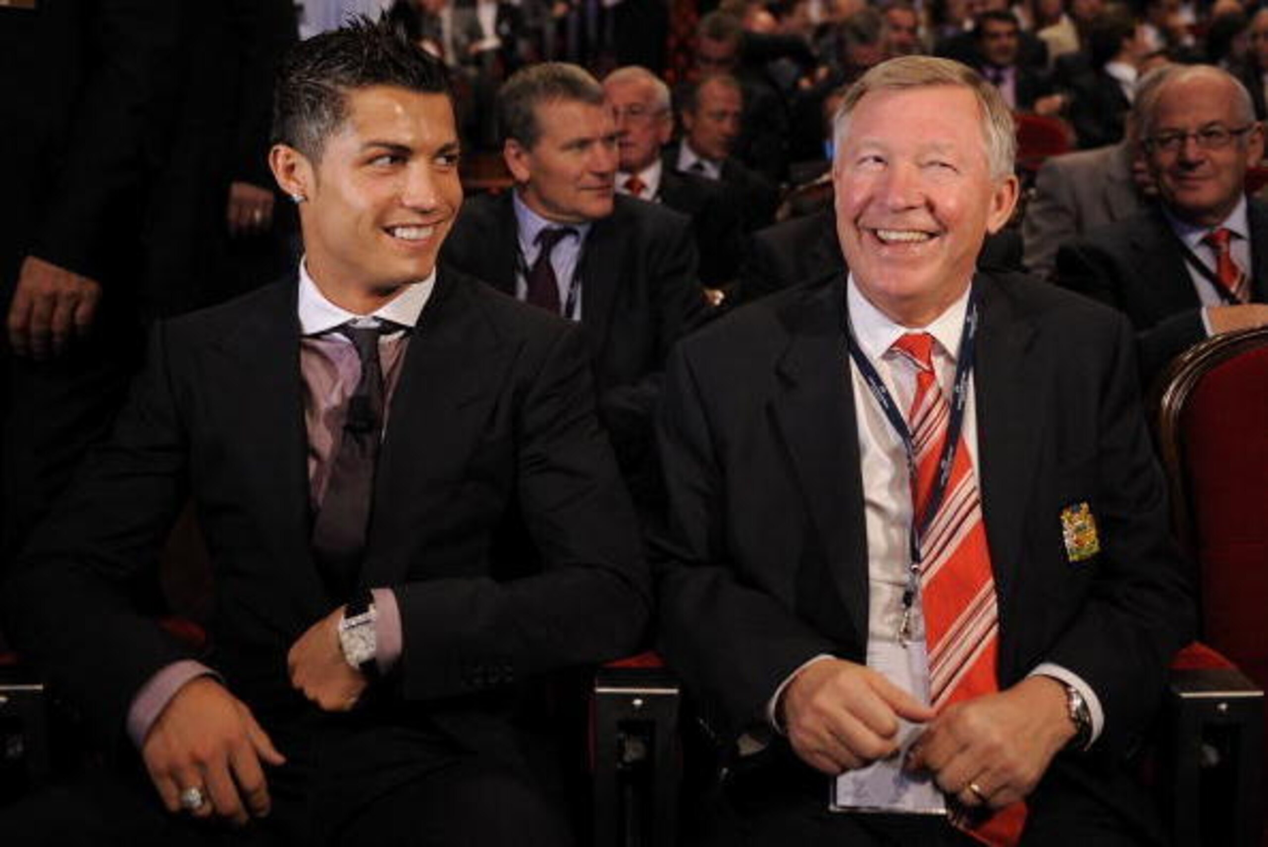 MONTE CARLO, MONACO - AUGUST 28:  Cristiano Ronaldo (L) of Manchester United laughs with his manager Sir Alex Ferguson while attending the UEFA Champions League Draw for the 2008/2009 season at the Grimaldi Center on August 28, 2008 in Monte Carlo, Monaco