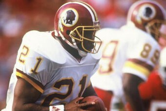 TEMPE, AZ - 1990s: Earnest Byner #21 of the Washington Redskins runs with the ball during a game against the Arizona Cardinals at Sun Devil Stadium in Tempe, Arizona in the early 1990s. (Photo by Rogers Photo Archive/Getty Images)