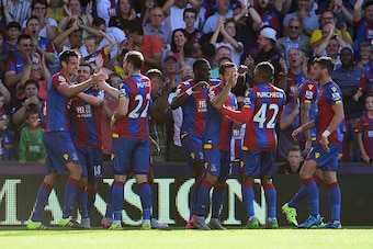 LONDON, ENGLAND - AUGUST 22: Scott Dann (1st L) of Crystal Palace celebrates scoring his team's first goal with his team mates during the Barclays Premier League match between Crystal Palace and Aston Villa at Selhurst Park on August 22, 2015 in London, E