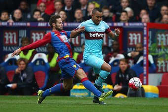 LONDON, ENGLAND - OCTOBER 17: Dimitri Payet of West Ham United and Yohan Cabaye of Crystal Palace compete for the ball during the Barclays Premier League match between Crystal Palace and West Ham United at Selhurst Park on October 17, 2015 in London, Engl
