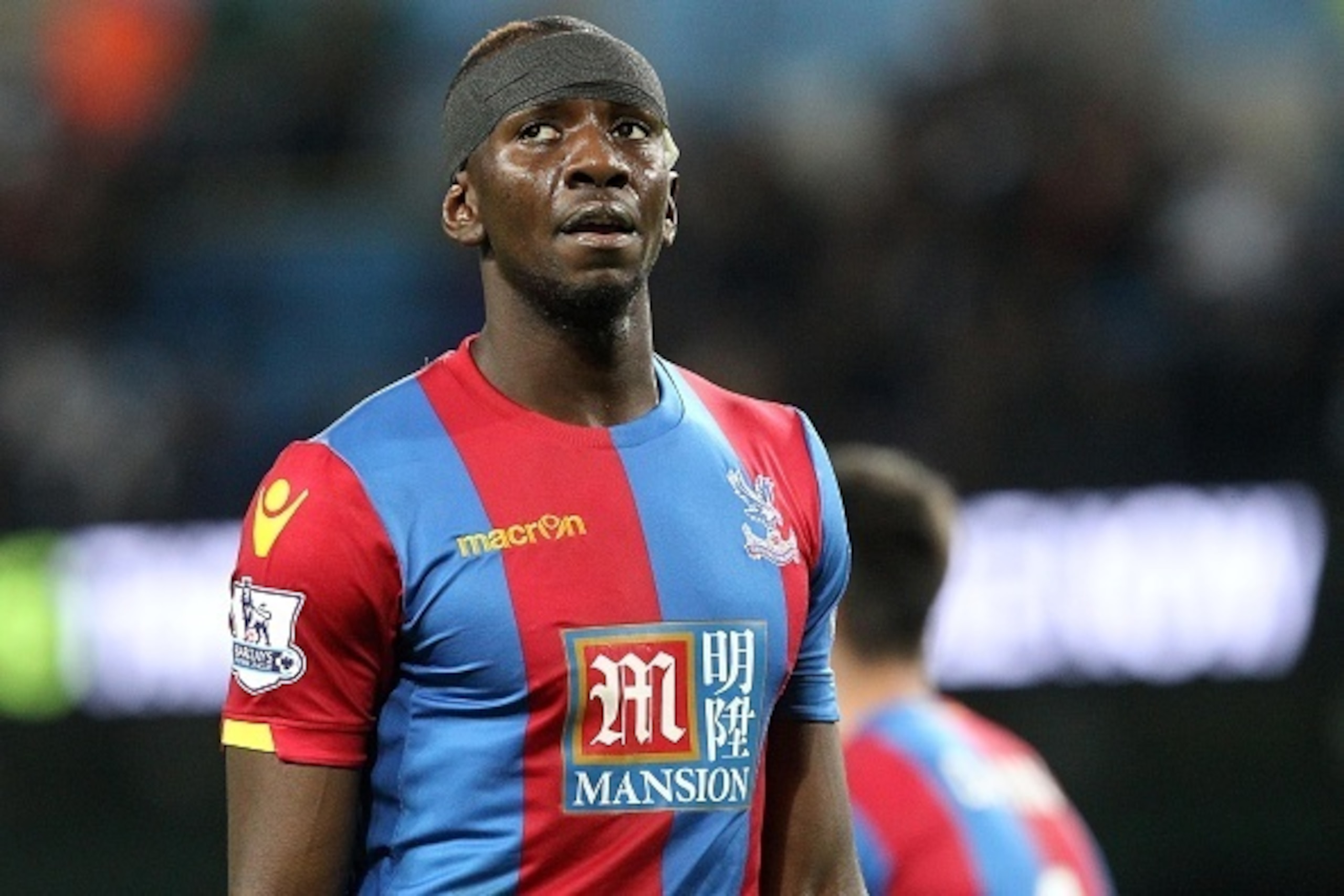 Crystal Palace's French-born Congolese midfielder Yannick Bolasie reacts during the English League Cup fourth round football match between Manchester City and Crystal Palace at The Etihad Stadium in Manchester, north west England on October 28, 2015. Manc