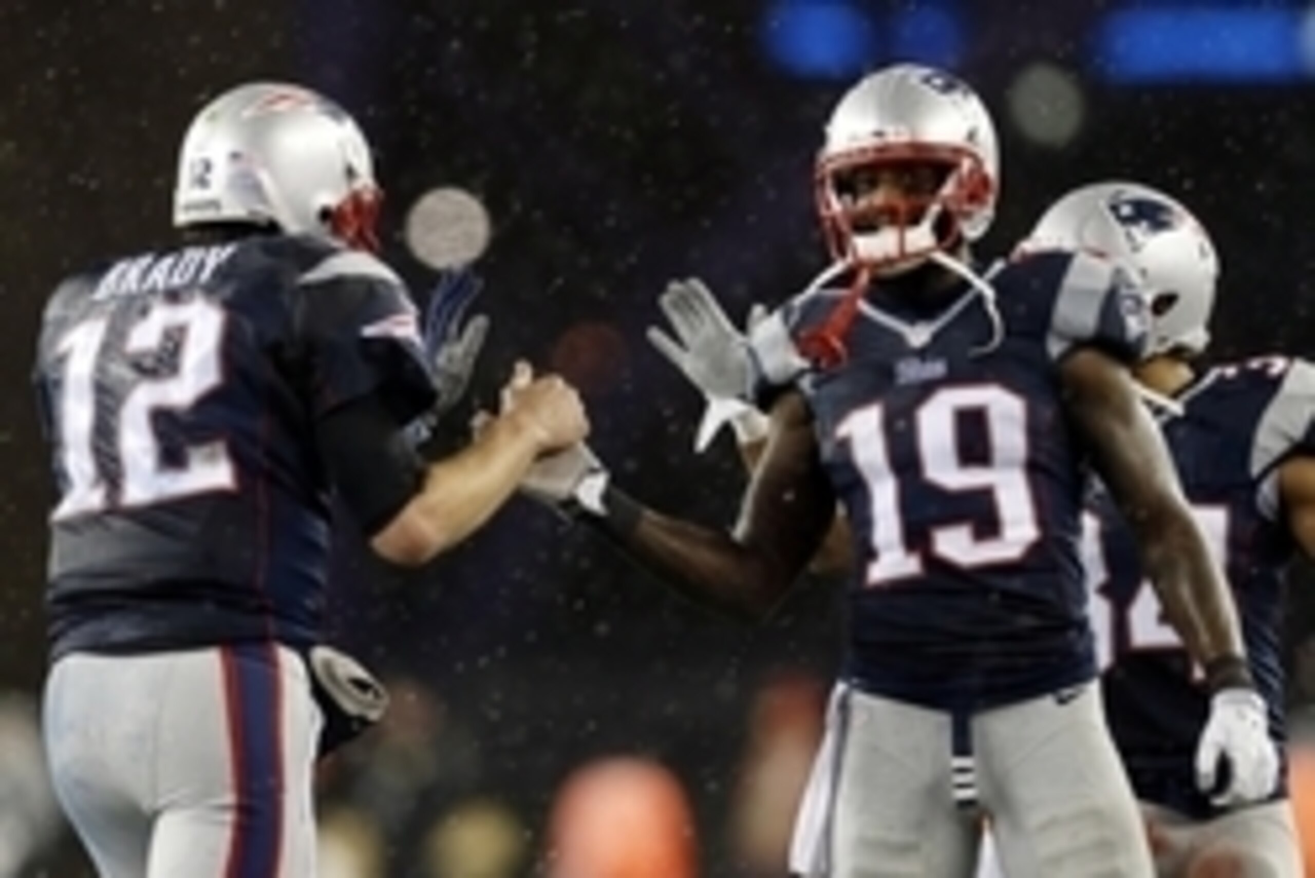 Jan 18, 2015; Foxborough, MA, USA; New England Patriots quarterback Tom Brady (12) celebrates with wide receiver Brandon LaFell (19) during the fourth quarter against the Indianapolis Colts in the AFC Championship Game at Gillette Stadium. Mandatory Credi