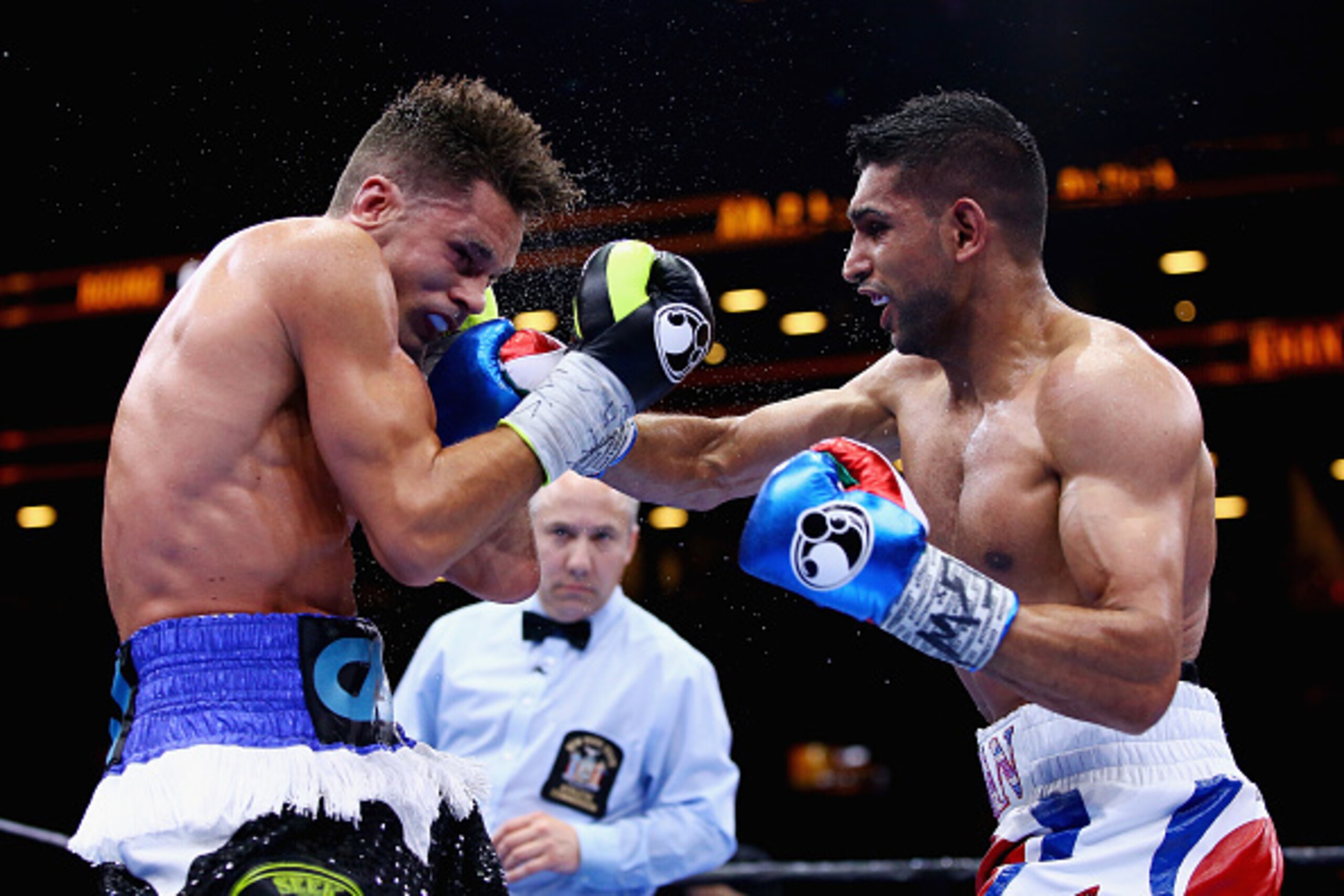 NEW YORK, NY - MAY 29:  Amir Khan punches Chris Algieri during their Welterweight bout at Barclays Center of Brooklyn on May 29, 2015 in New York City.  (Photo by Al Bello/Getty Images)