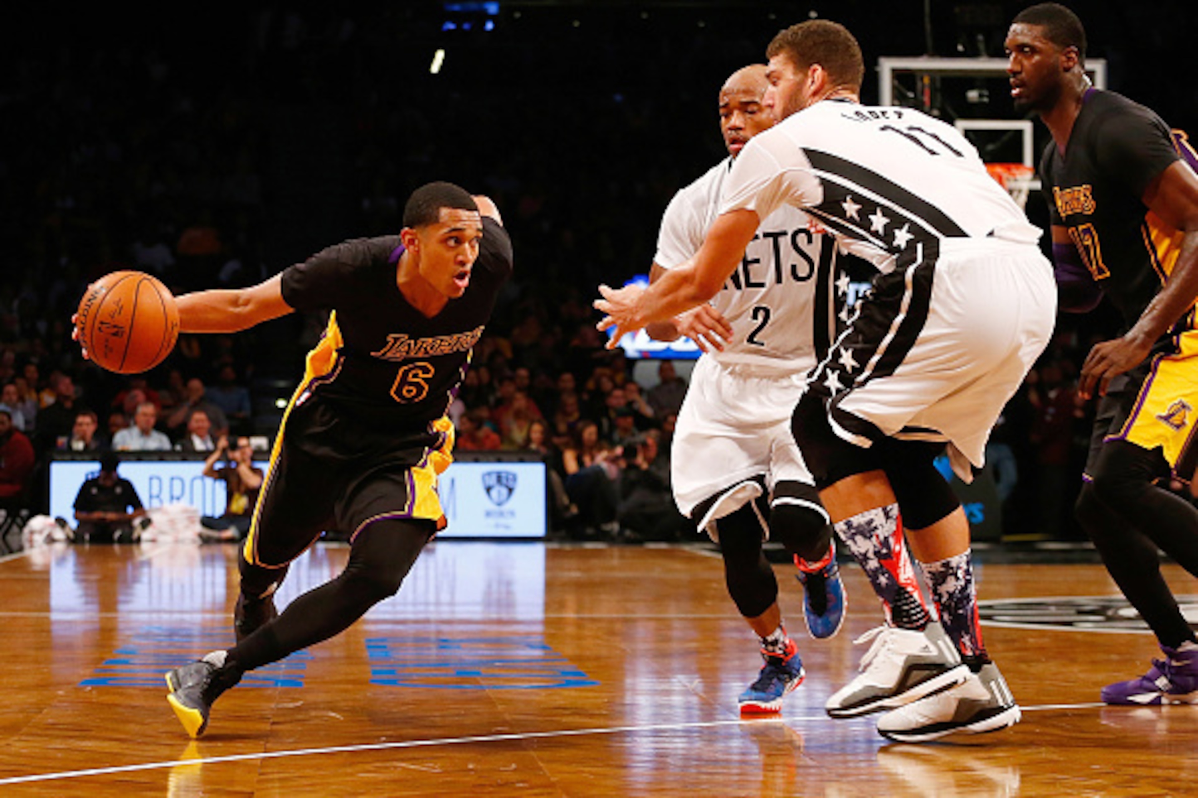 NEW YORK, NY - NOVEMBER 06:  Jordan Clarkson #6 of the Los Angeles Lakers drives to the basket against Brook Lopez #11 of the Brooklyn Nets at the Barclays Center on November 6, 2015 in the Brooklyn borough of New York City. The Lakers defeated the Nets 1