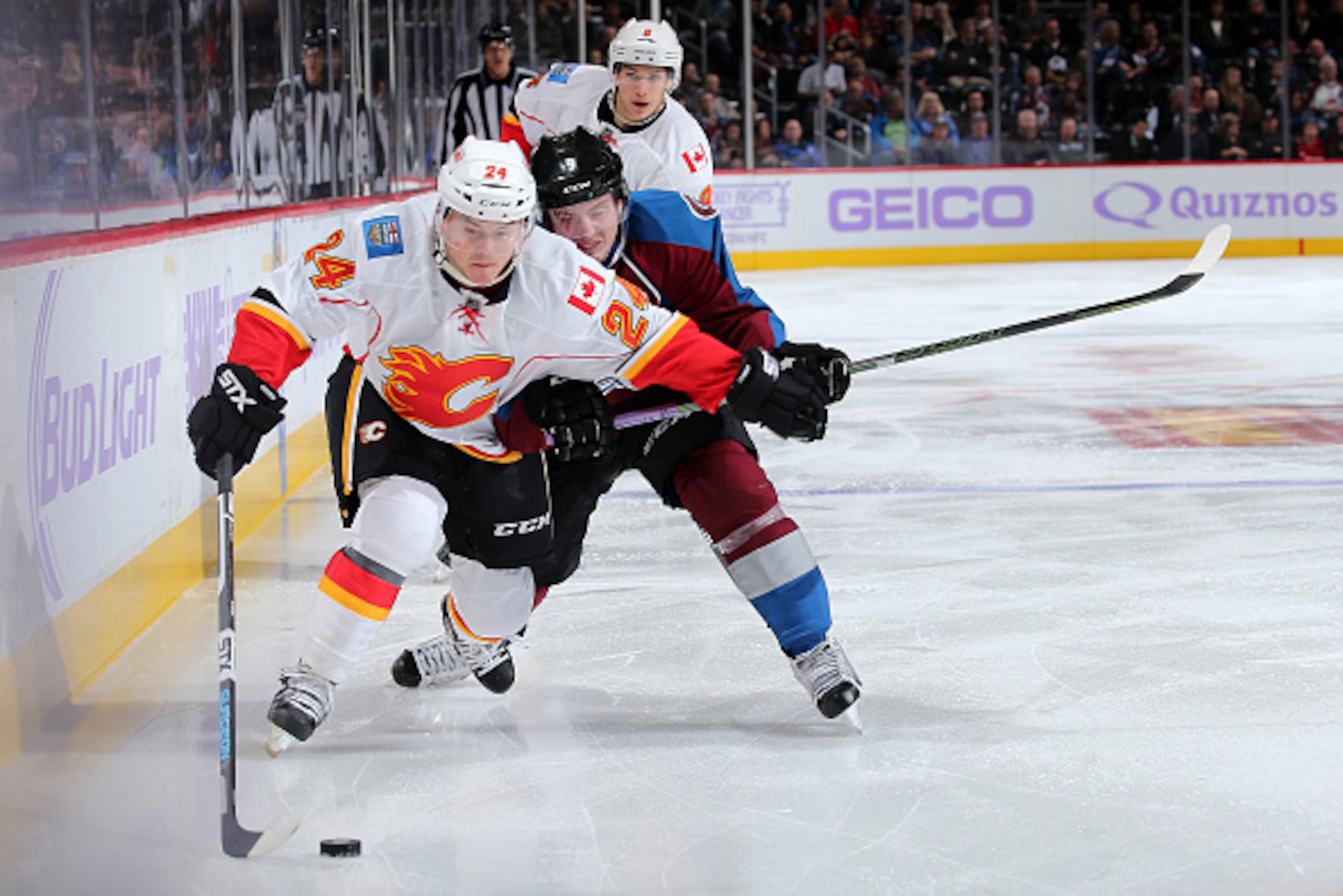 DENVER, CO - NOVEMBER 03:  Jiri Hudler #24 of the Calgary Flames controls the puck against Matt Duchene #9 of the Colorado Avalanche at Pepsi Center on November 3, 2015 in Denver, Colorado. The Avalanche defeated the Flames 6-3.  (Photo by Doug Pensinger/