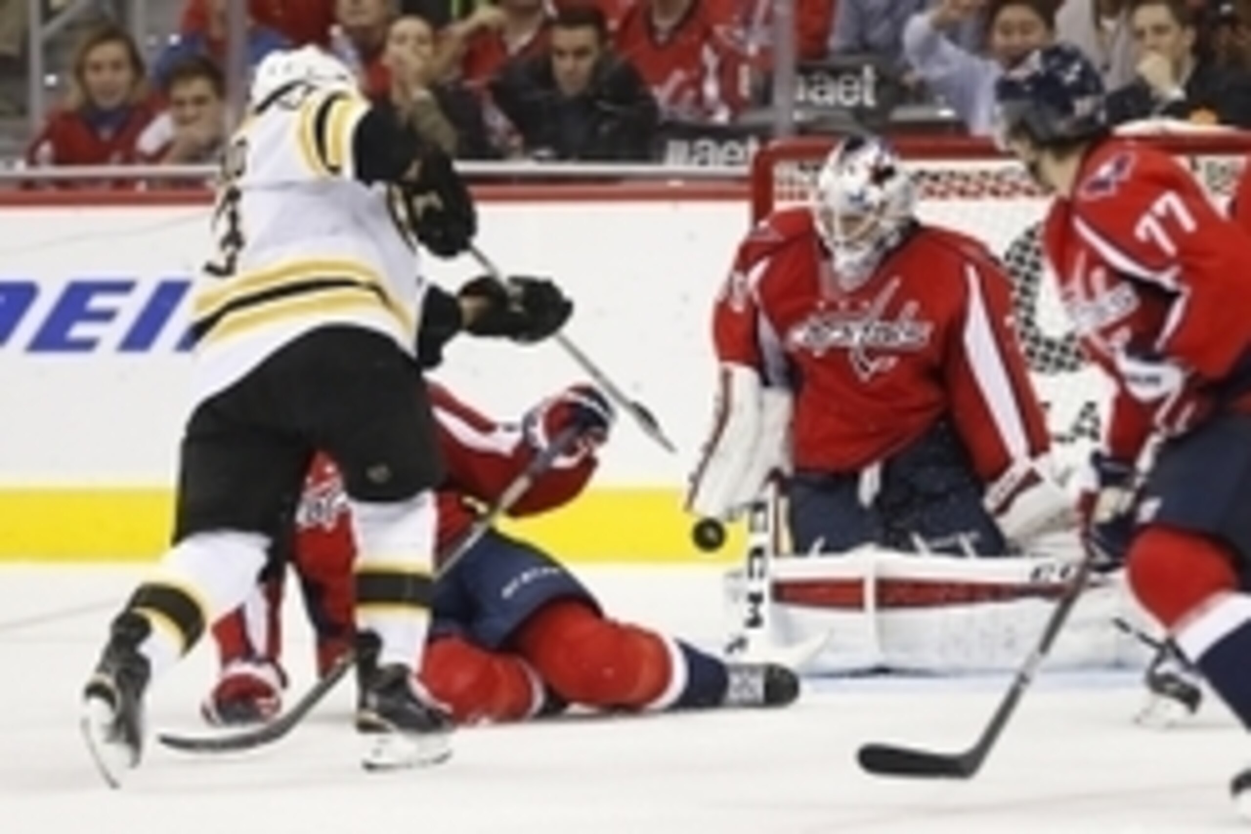 Nov 5, 2015; Washington, DC, USA; Washington Capitals goalie Braden Holtby (70) makes a save Boston Bruins left wing Brad Marchand (63) in the second period at Verizon Center. Mandatory Credit: Geoff Burke-USA TODAY Sports