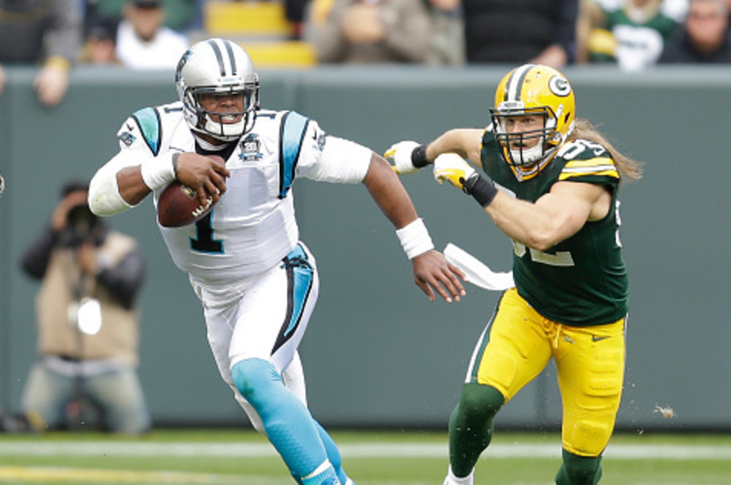 GREEN BAY, WI - OCTOBER 19: Cam Newton #1 of the Carolina Panthers runs with the football the football against the Green Bay Packers at Lambeau Field on October 19, 2013 in Green Bay, Wisconsin. (Photo by Mike McGinnis/Getty Images)