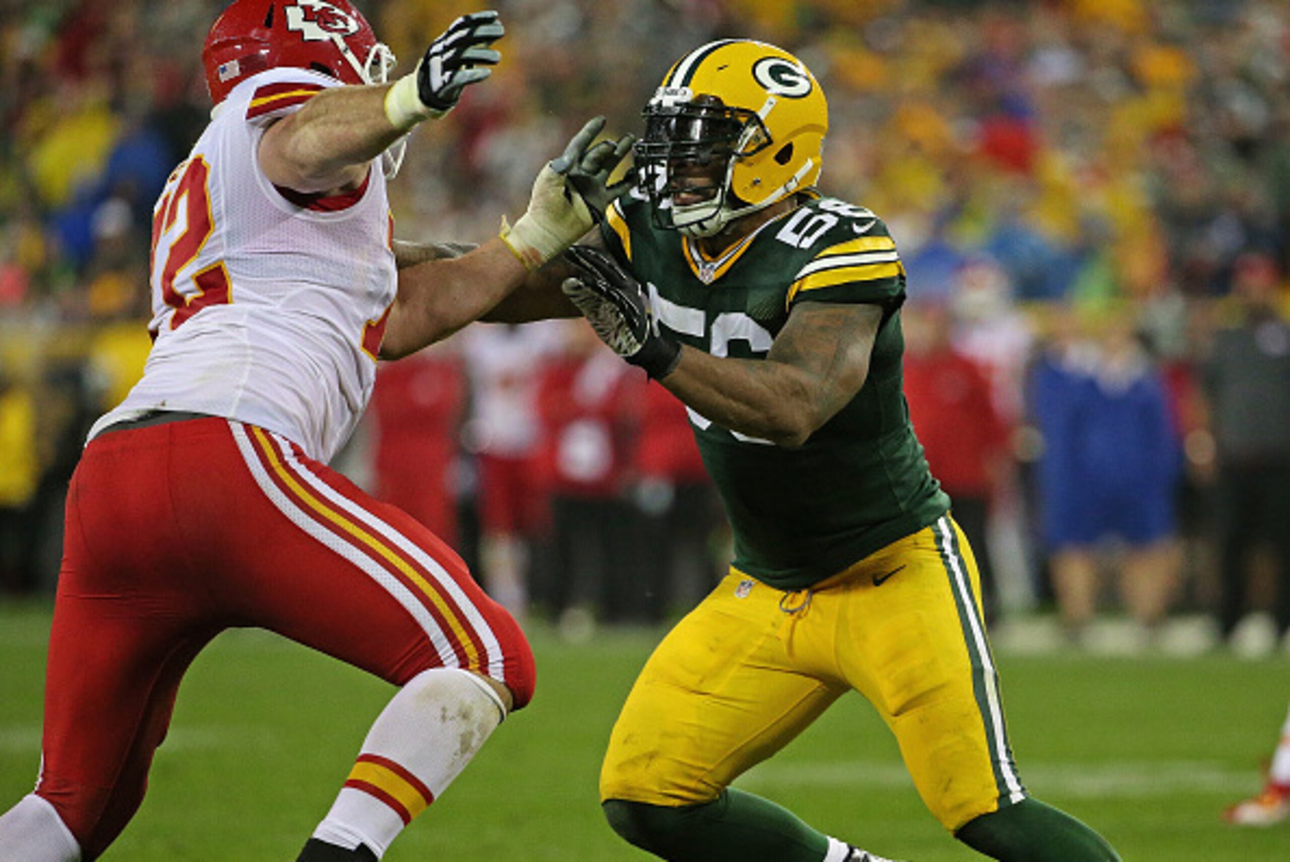 GREEN BAY, WI - SEPTEMBER 28:  Julius Peppers #56 of the Green Bay Packers rushes aainst Eric Fisher #72 of the Kansas City Chiefs at Lambeau Field on September 28, 2015 in Green Bay, Wisconsin. The Packers defeated the Chiefs 38-28.  (Photo by Jonathan D