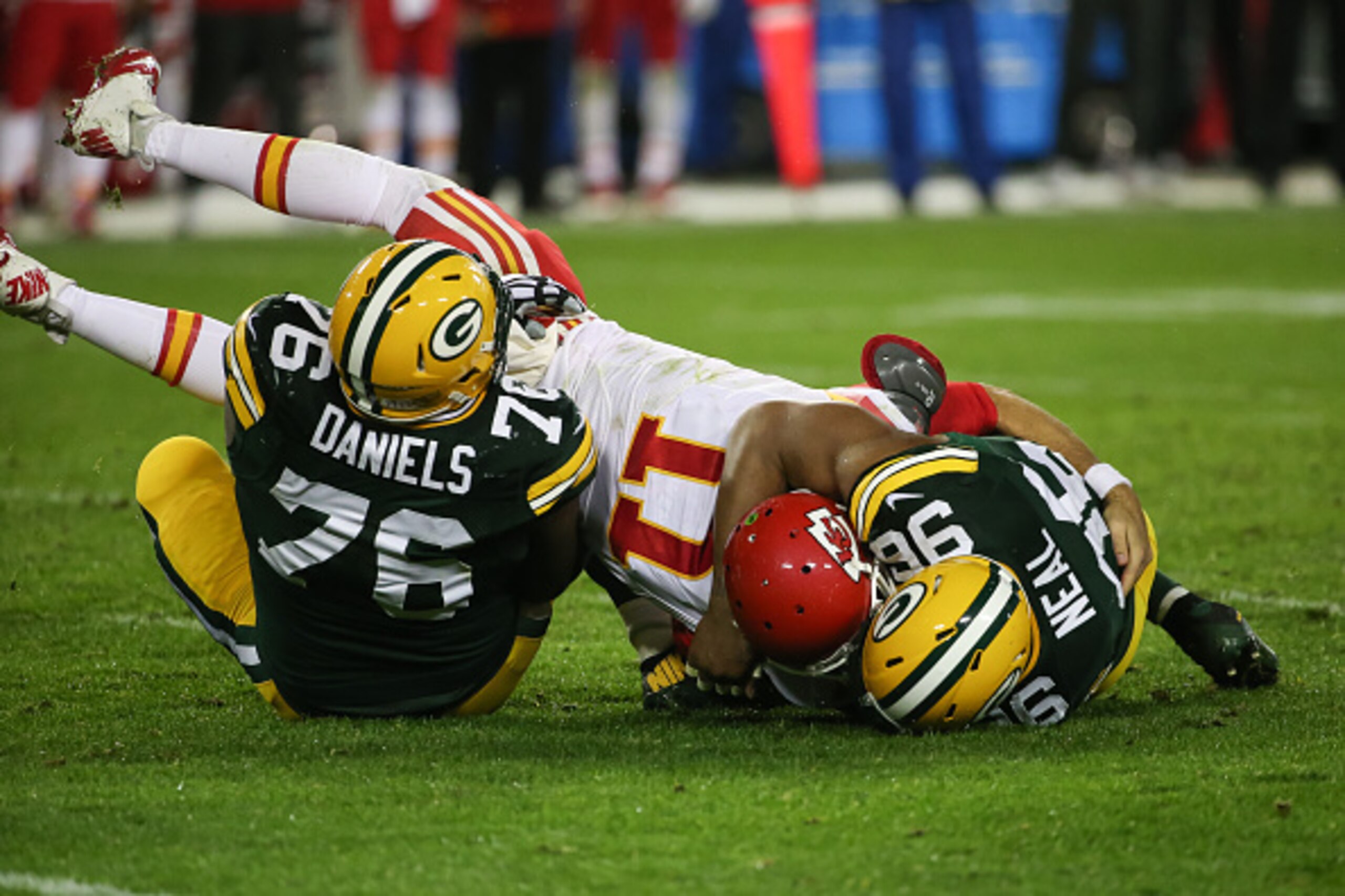 GREEN BAY, WI - SEPTEMBER 28: Mike Neal #96 and Mike Daniels #76 of the Green Bay Packers sack quarterback Alex Smith #11 of the Kansas City Chiefs in the second half at Lambeau Field on September 28, 2015 in Green Bay, Wisconsin. The Green Bay Packer GREEN BAY, WI - SEPTEMBER 28: Mike Neal #96 and Mike Daniels #76 of the Green Bay Packers sack quarterback Alex Smith #11 of the Kansas City Chiefs in the second half at Lambeau Field on September 28, 2015 in Green Bay, Wisconsin. The Green Bay Packer